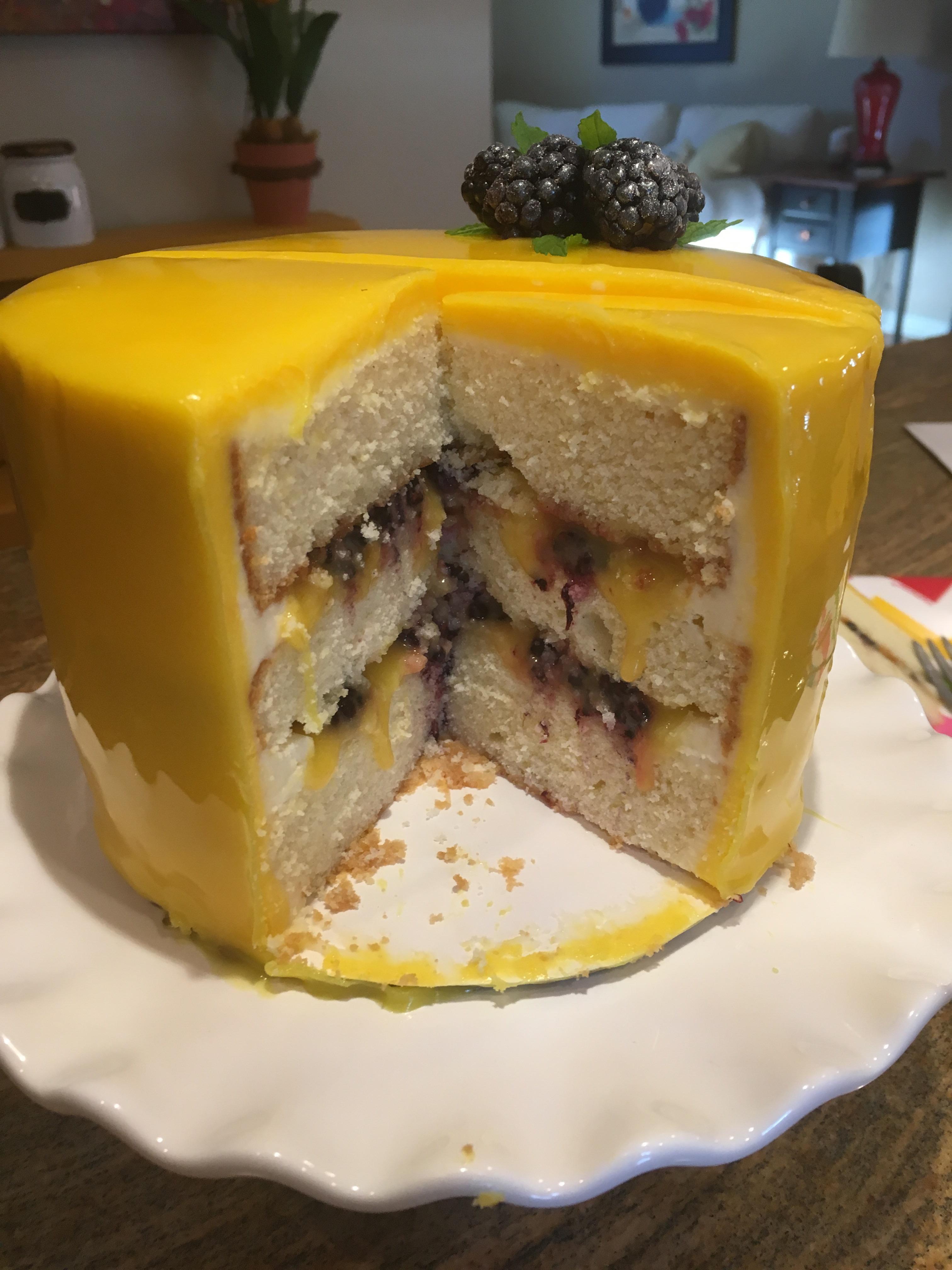 Passion fruit blackberry vanilla cake! Layers of vanilla cake filled with passion fruit curd and