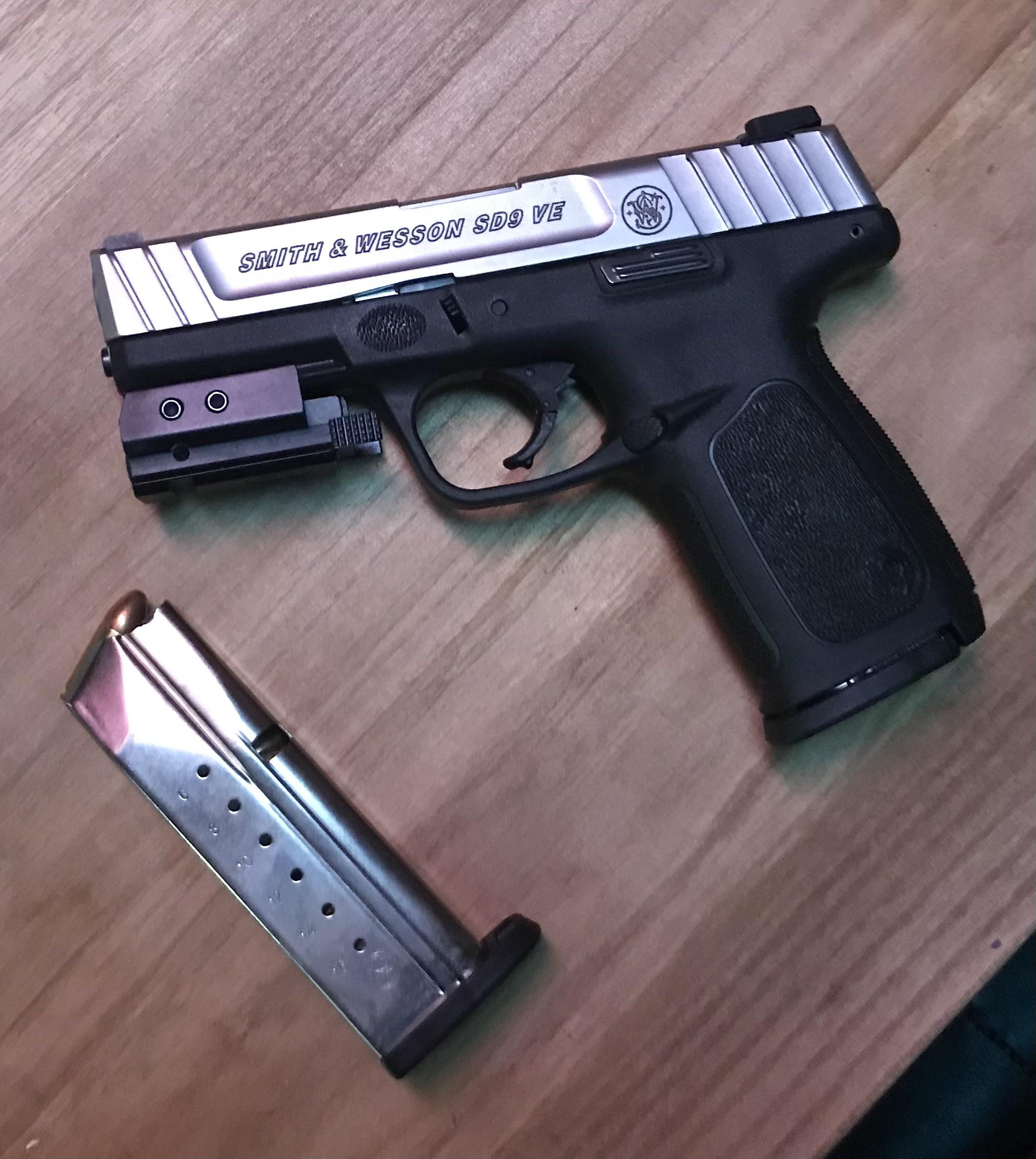 My night stand gun with laser attachment. r/guns