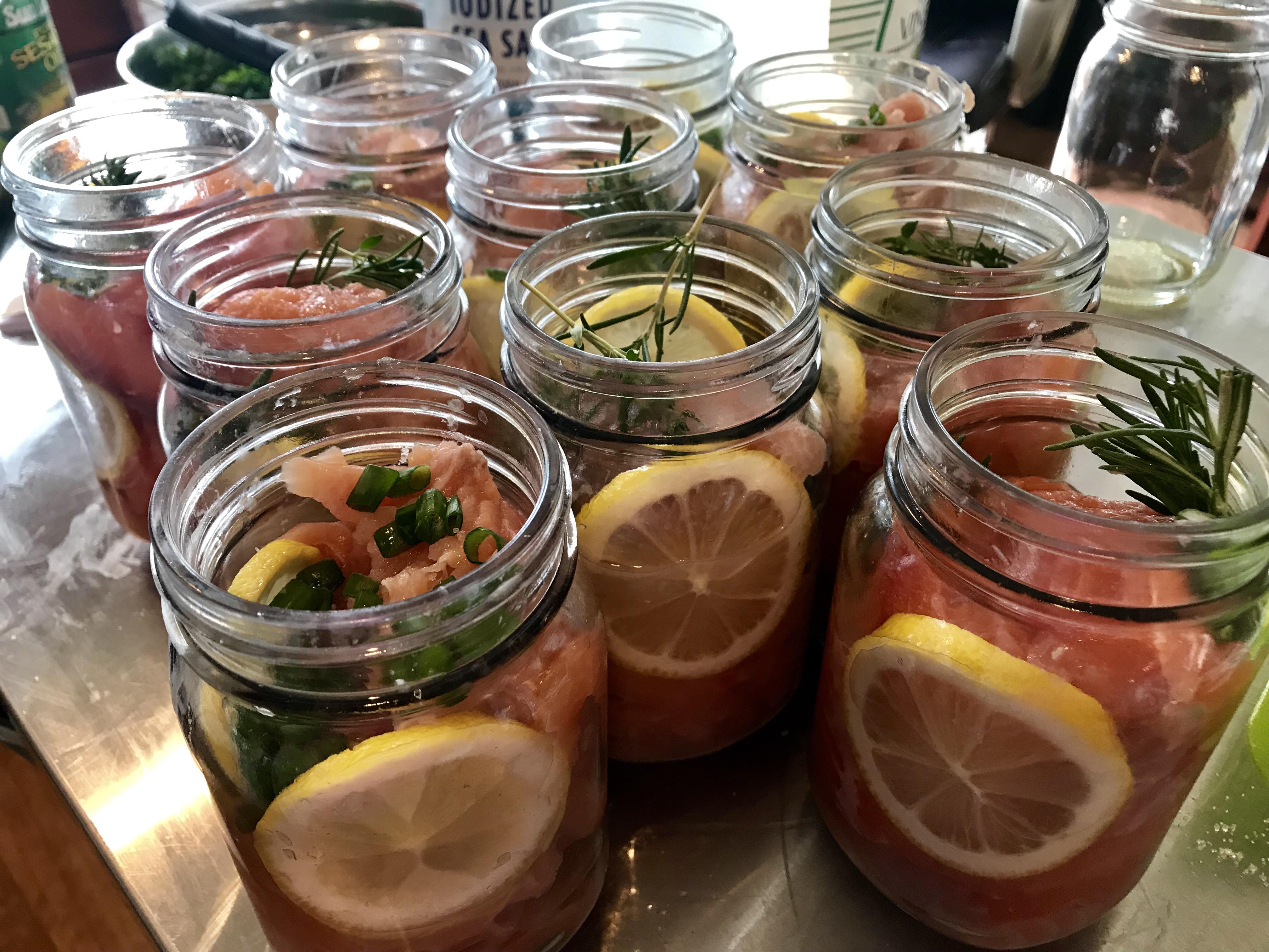 Pink salmon being canned with a brown sugar brine and different