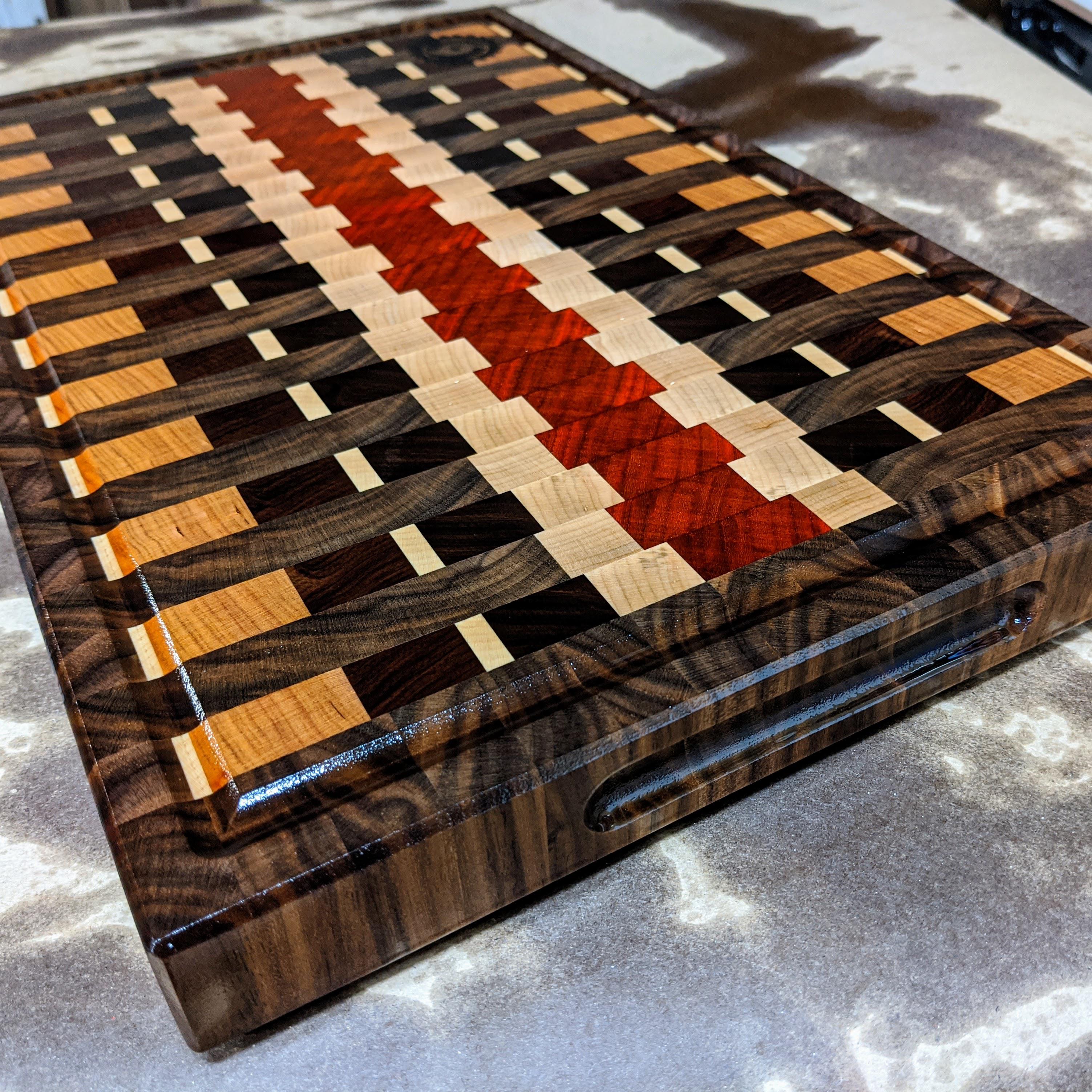 End Grain board just finished. Walnut, Maple, Cherry, Morado, and Padauk. 18" x 12" x 1.5" r