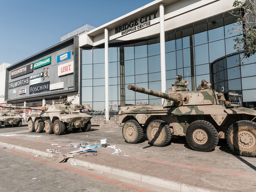 South African Rooikat armoured cars deployed after severe looting and