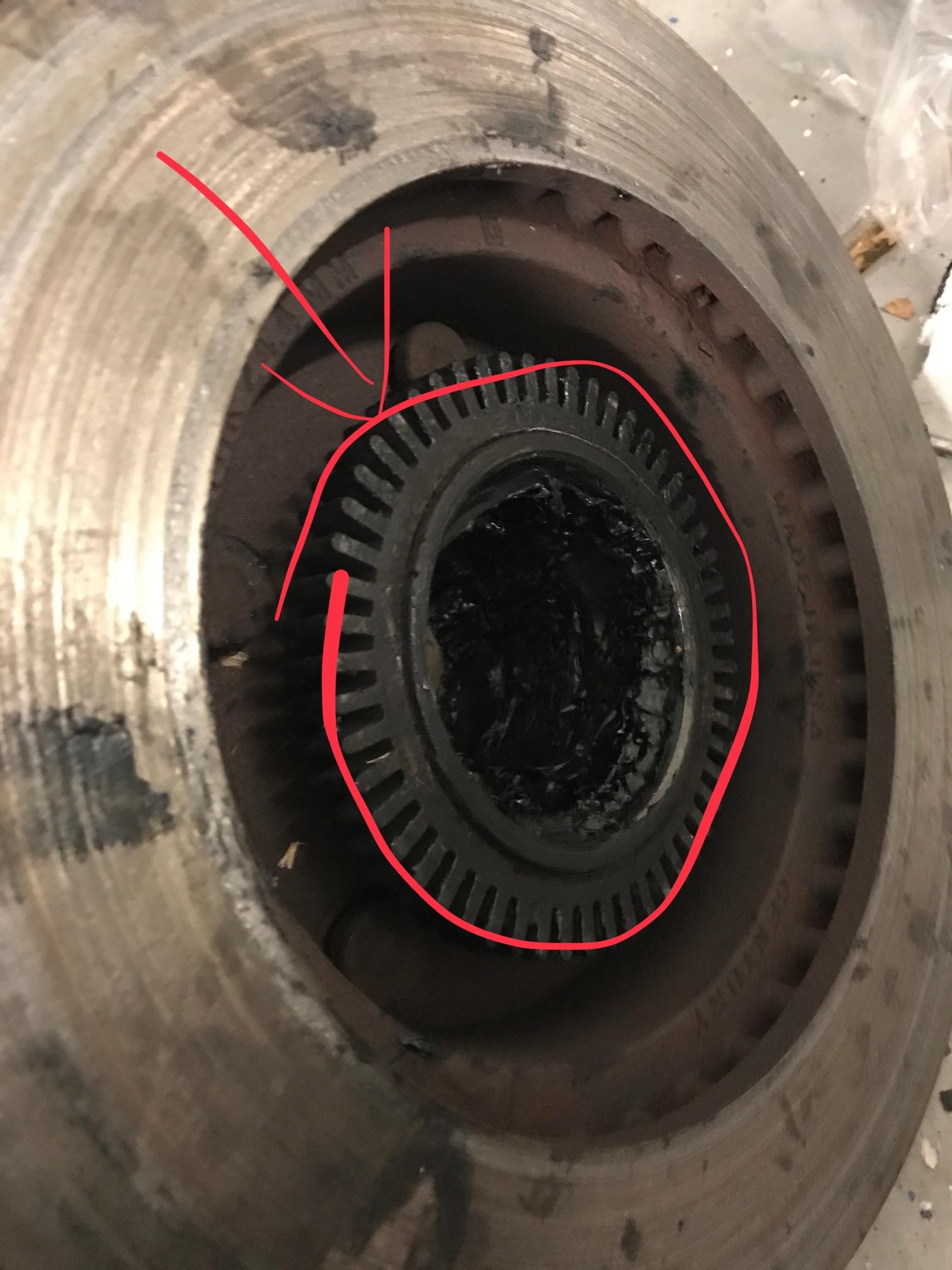 How do I remove this gear looking piece from my wheel hub so I can