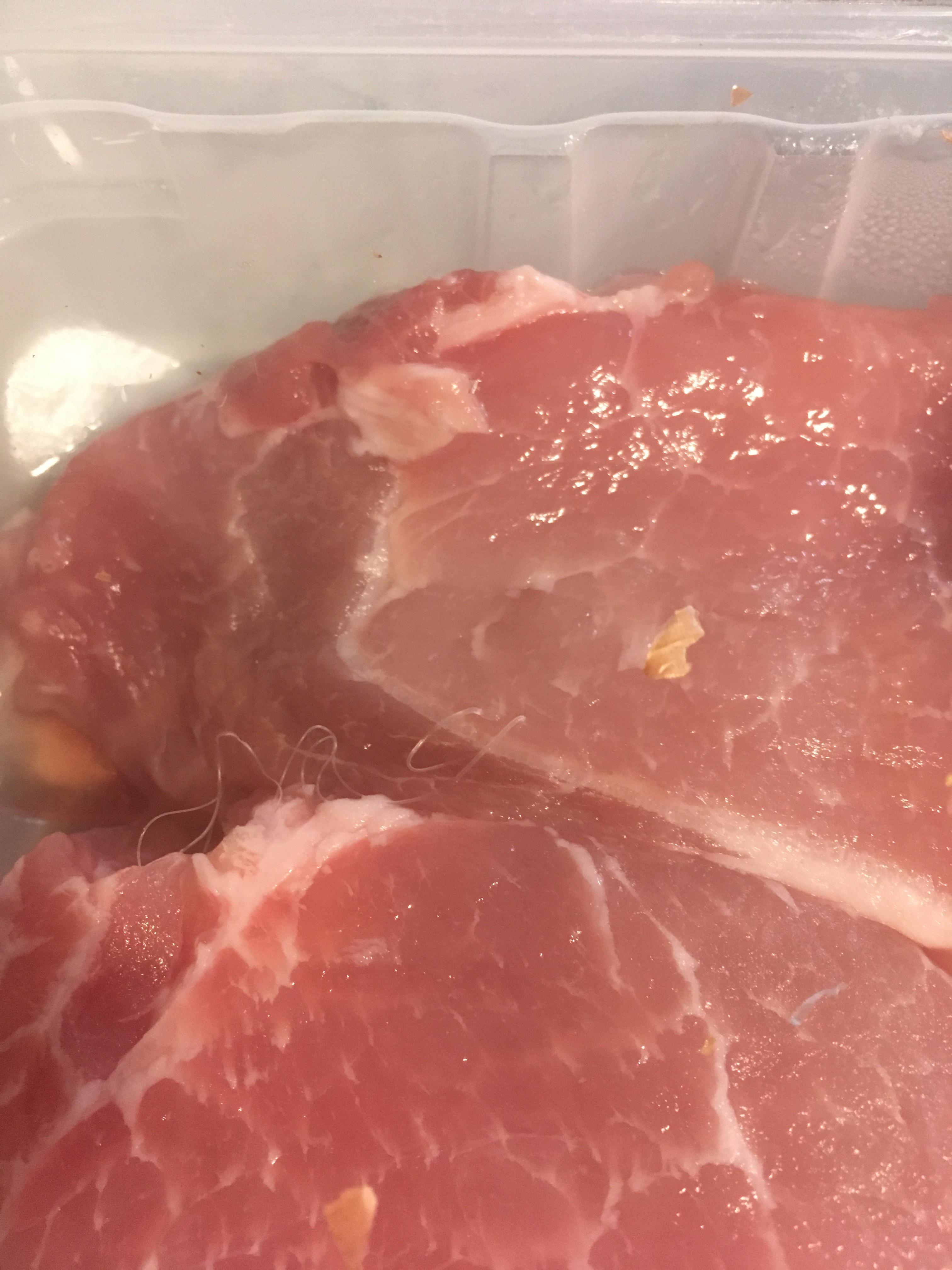 Is this a worm in my unopened package of pork chops? r/whatisthisthing