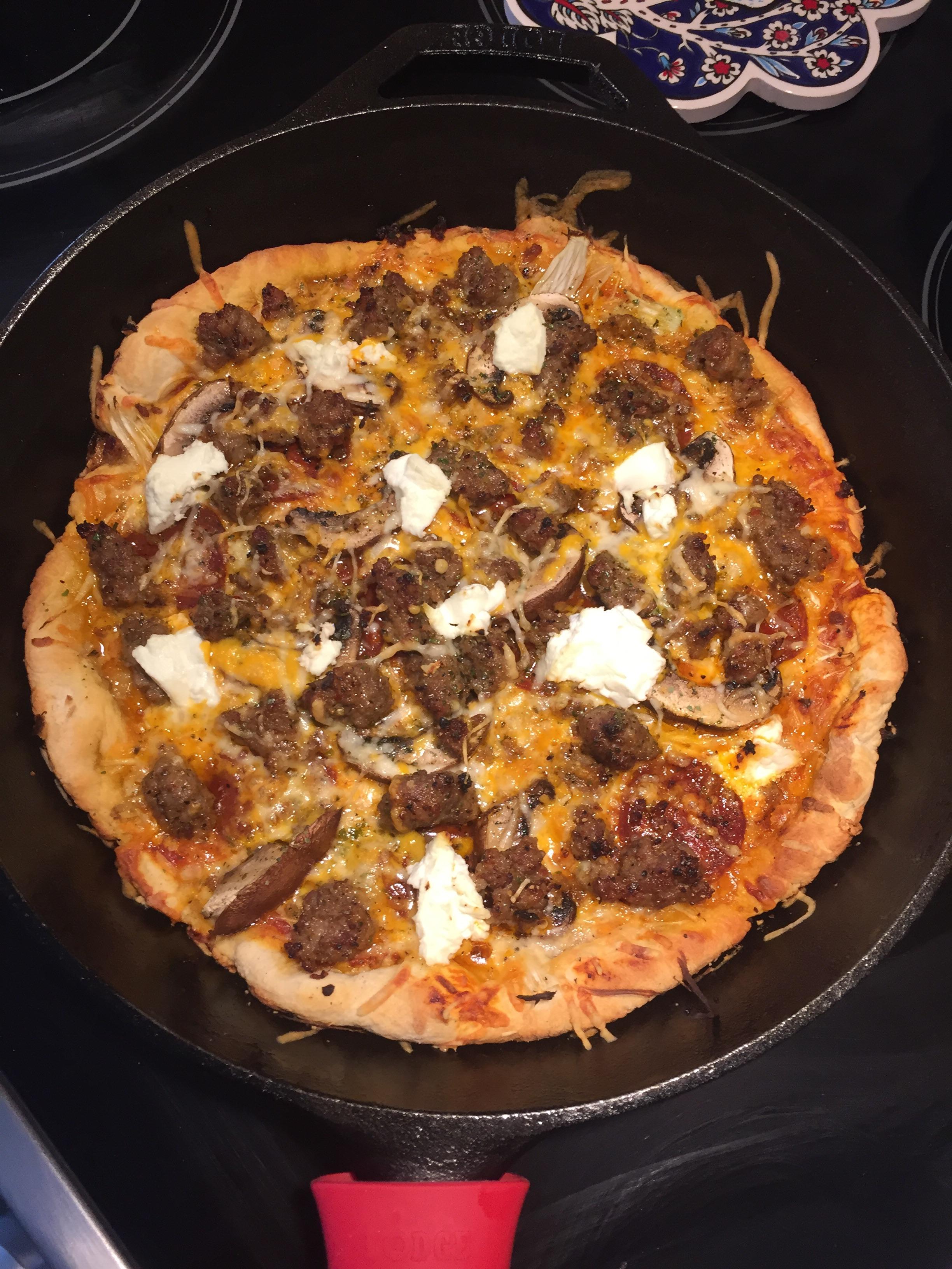 [Homemade] cast iron pizza with crumbled sausage, fennel, and goats