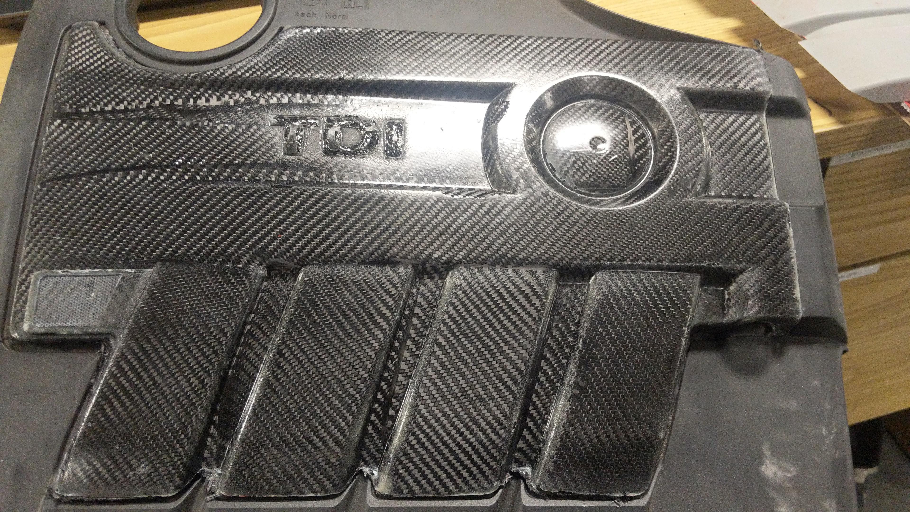 My first attempt at making a carbon fiber engine cover r/projectcar