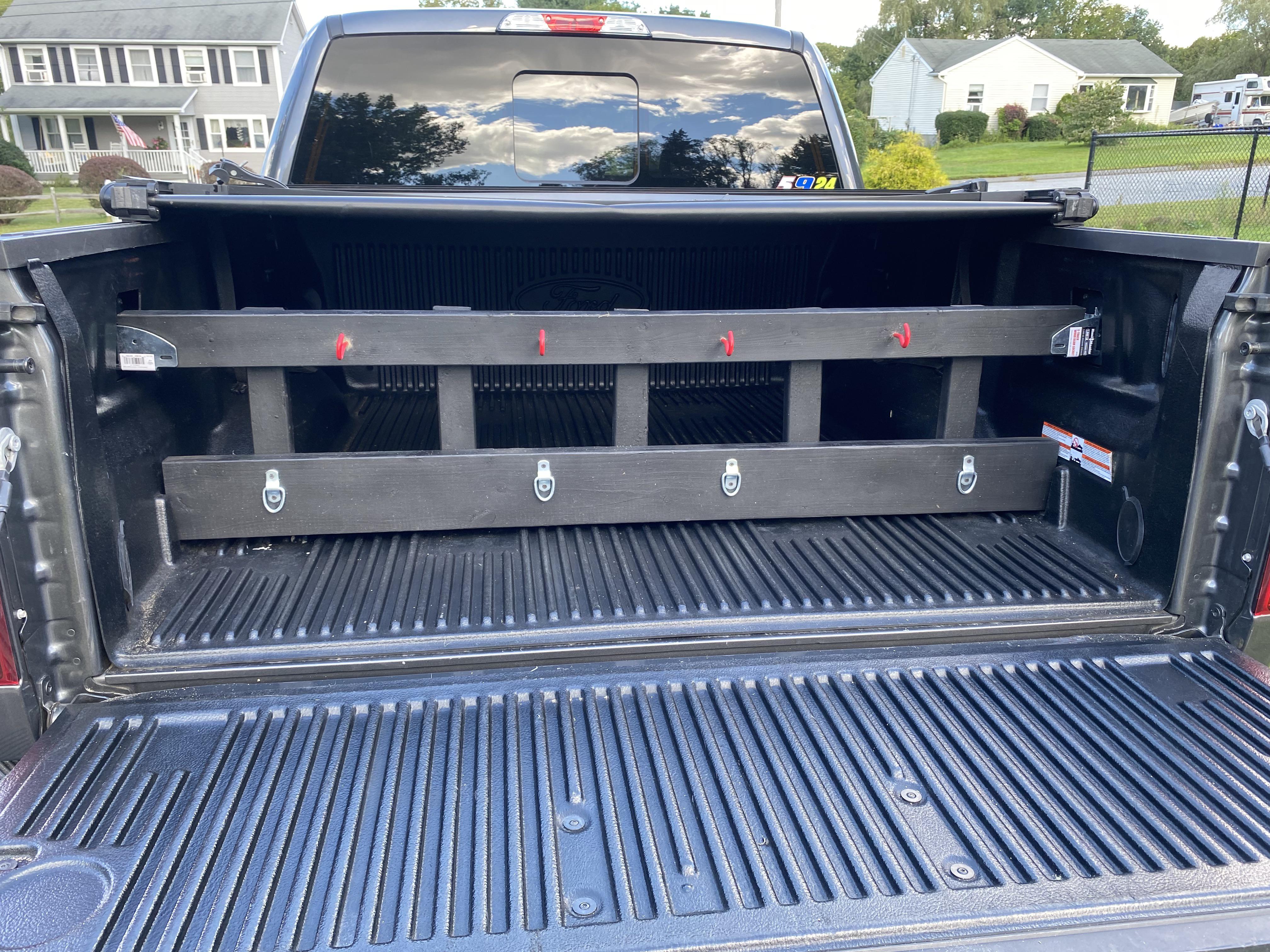 Made a bed divider out of some scrap wood. r/f150