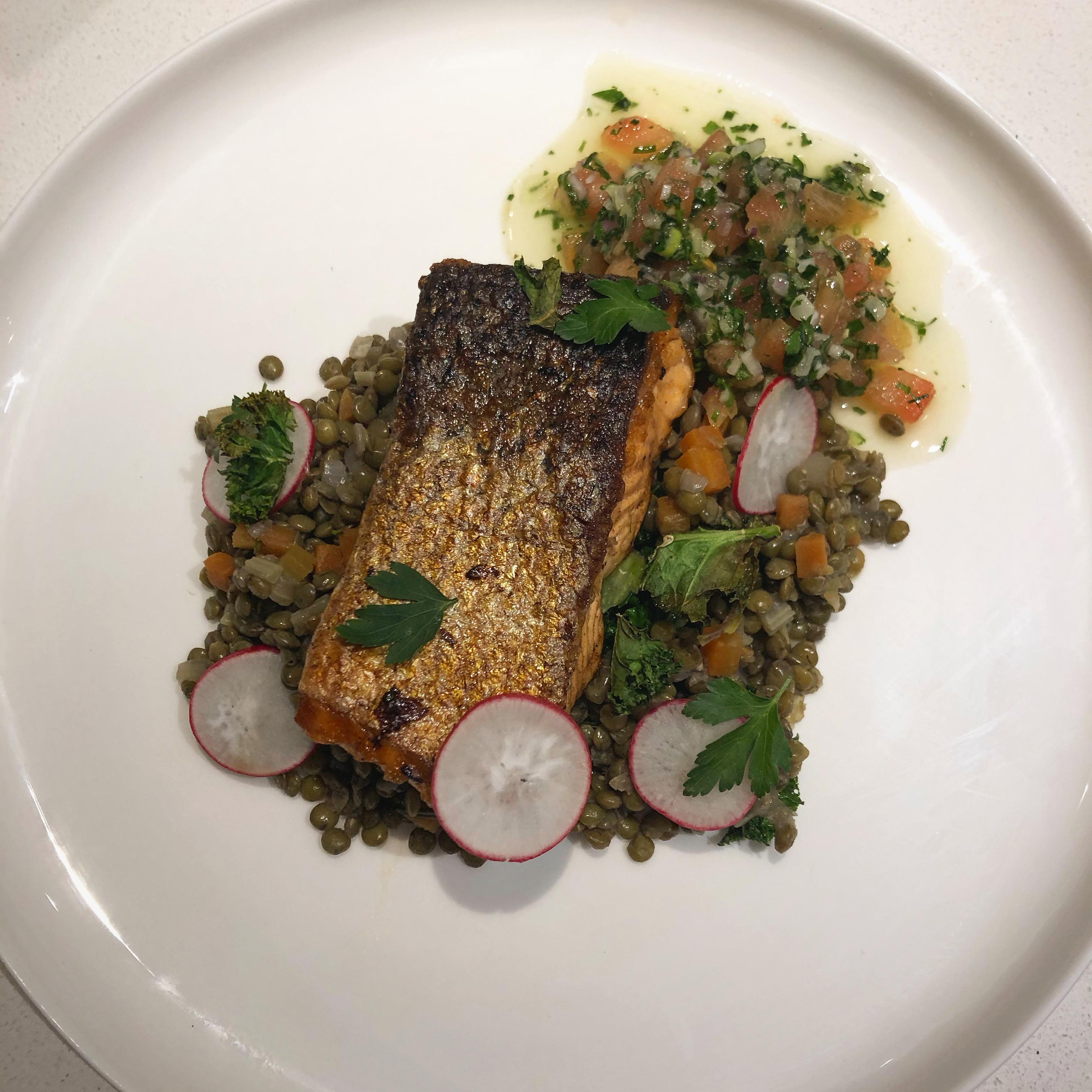 Crispy Skin Salmon, Braised Lentils, Sauce Vierge, Sautéed Kale, Radish