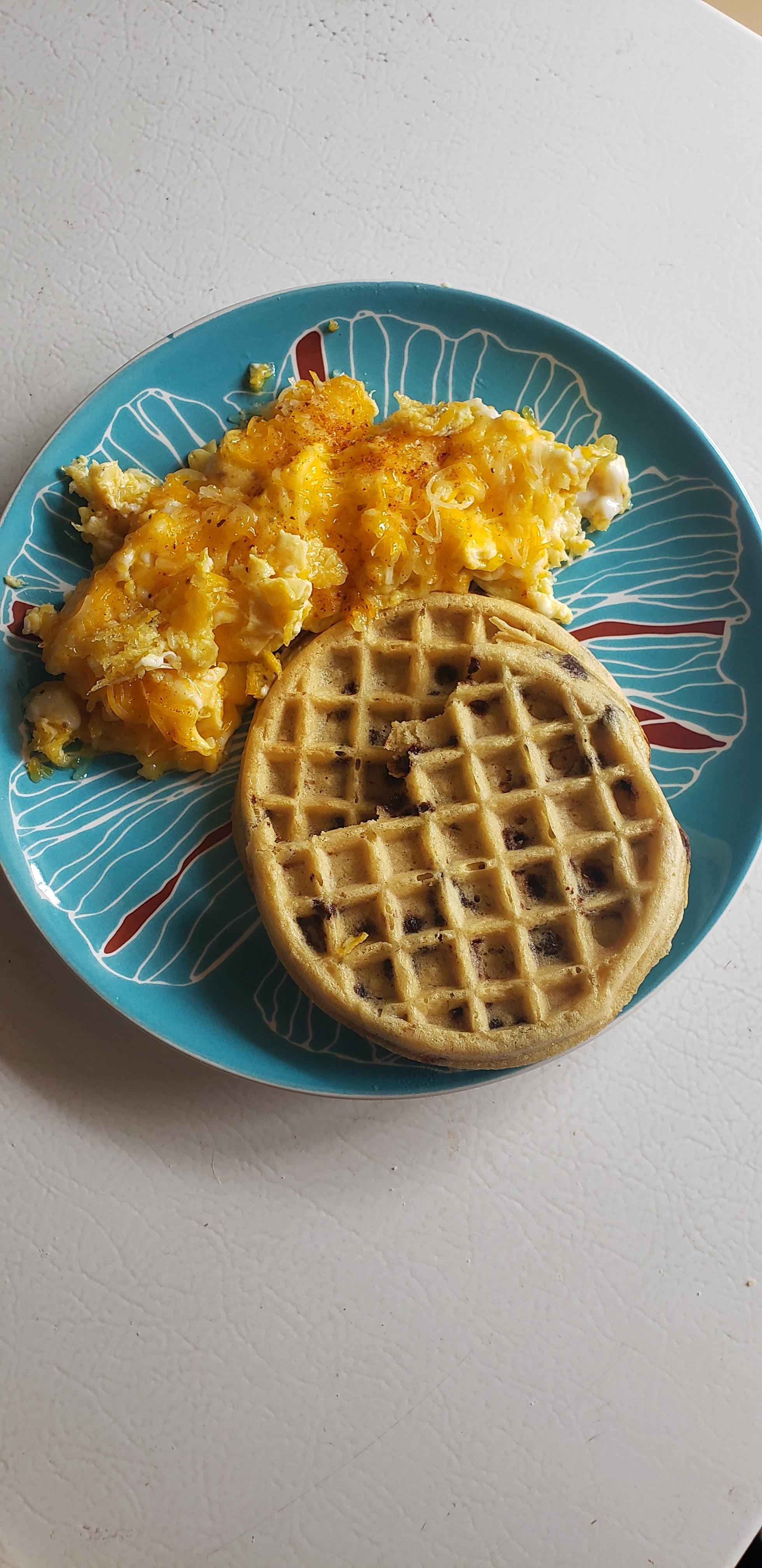 Cheesy scrambled eggs with old bay, and chocolate chip waffles ) r