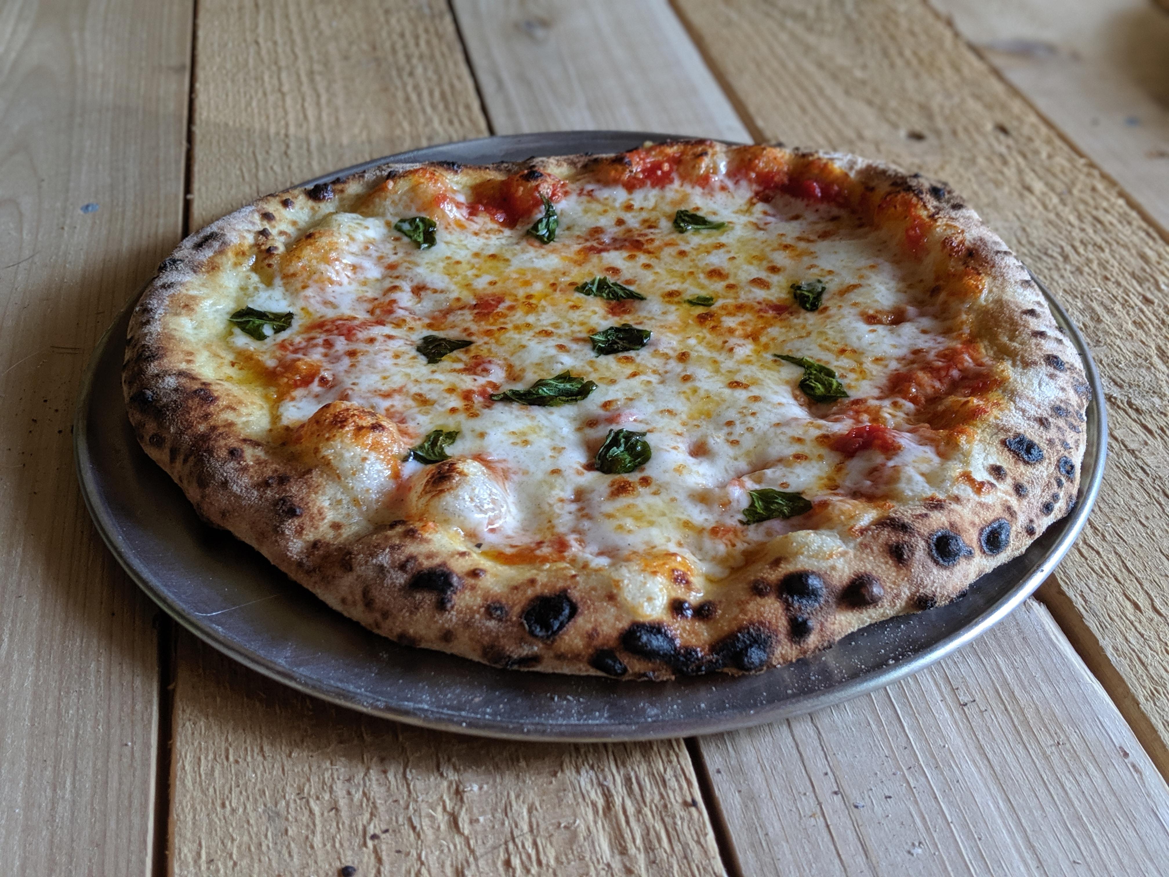 A simple margherita. Fresh shredded mozzarella, basil, crushed tomatoes