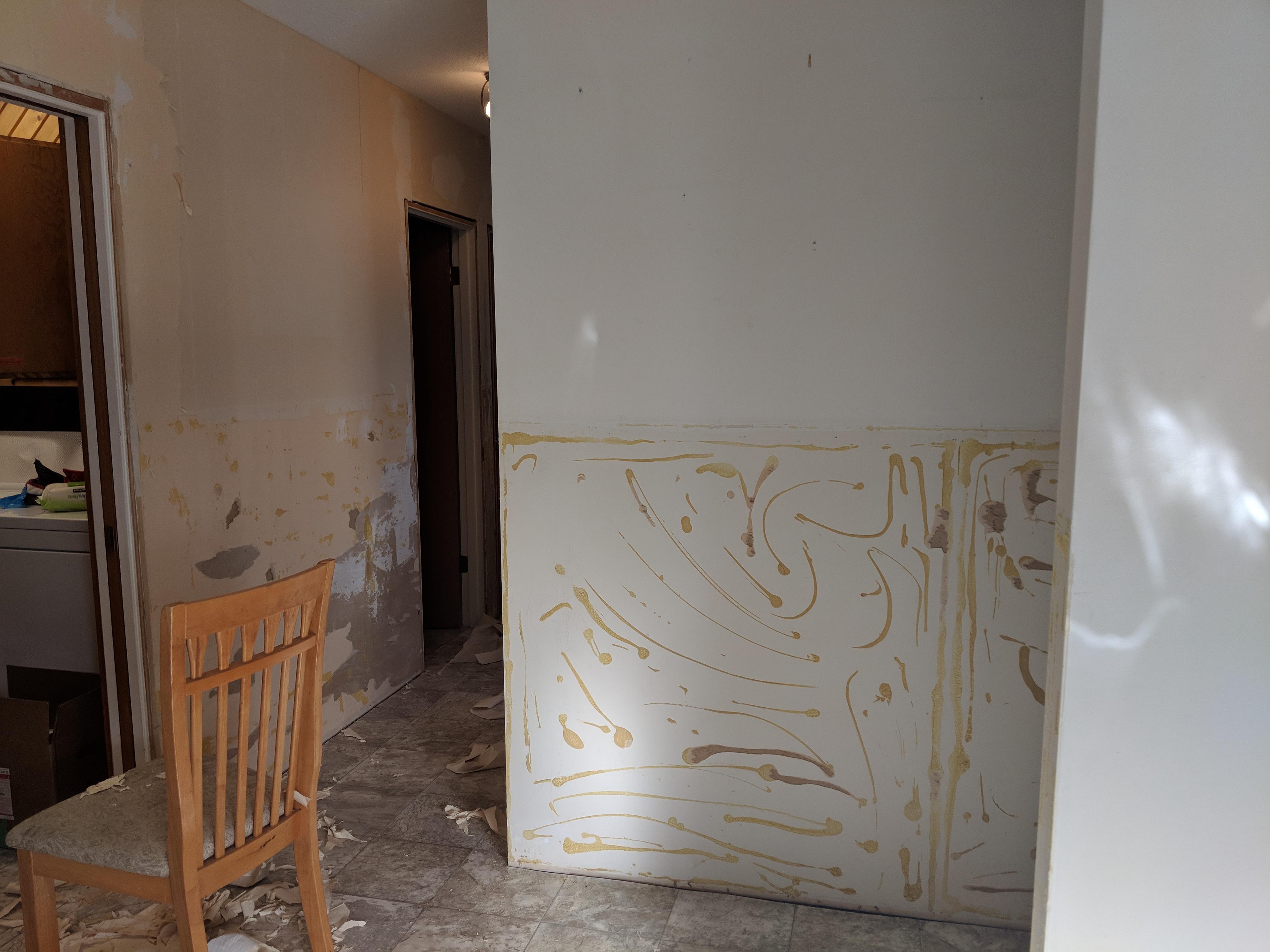 Sos! I pulled off some old paneling and wallpaper to uncover this mess
