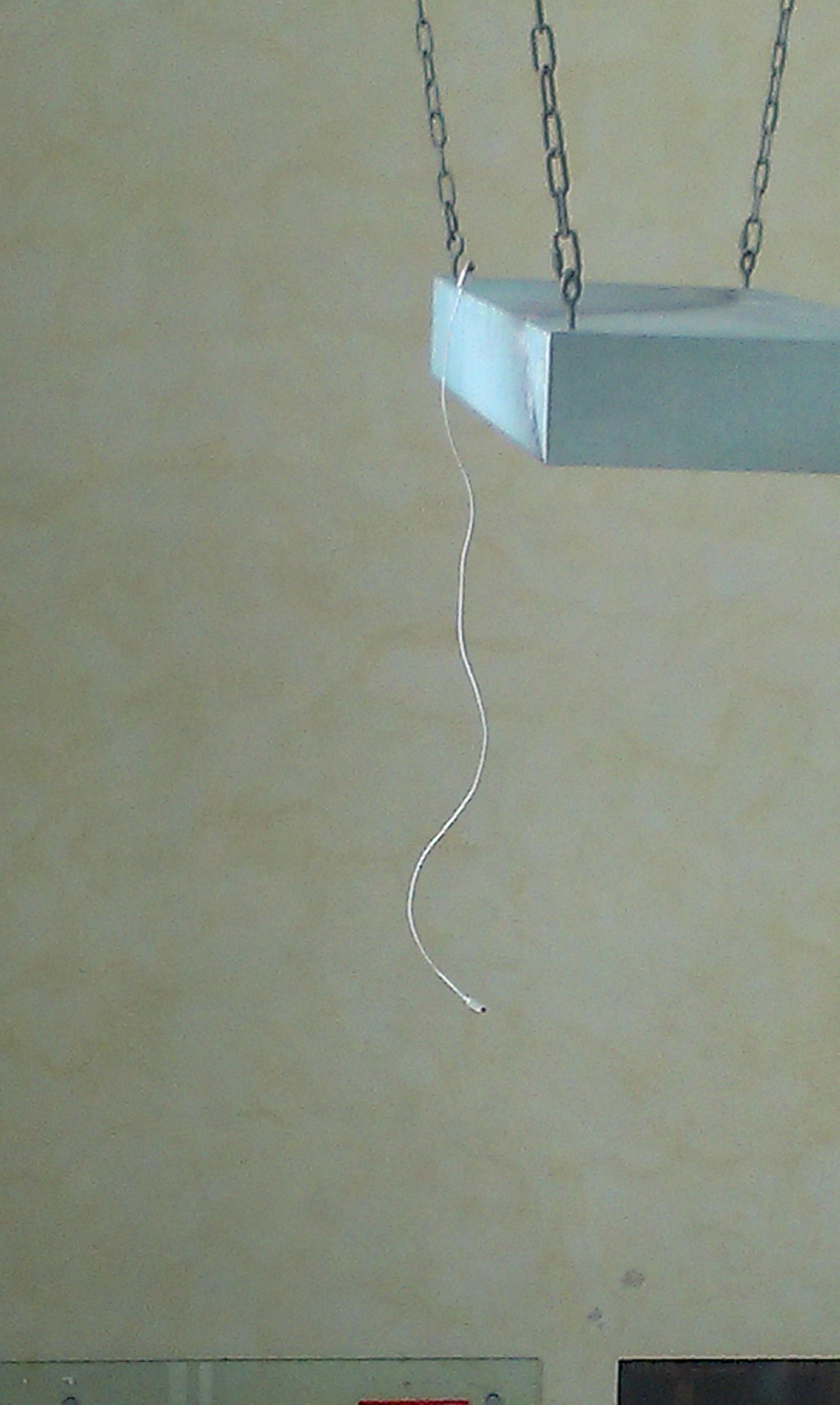 USB charging cable fell from the upper floor and landed "on" the lamp