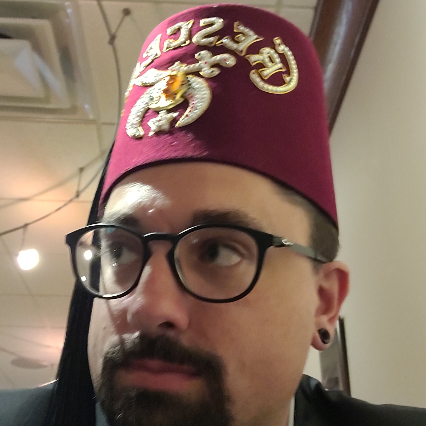 I wear funny hats. Here's my newest (aka I joined the Shrine) r