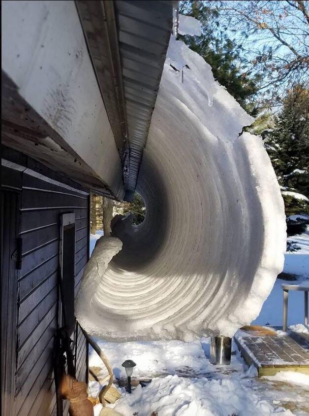 Snow melting off a roof in Wisconsin. r/blackmagicfuckery