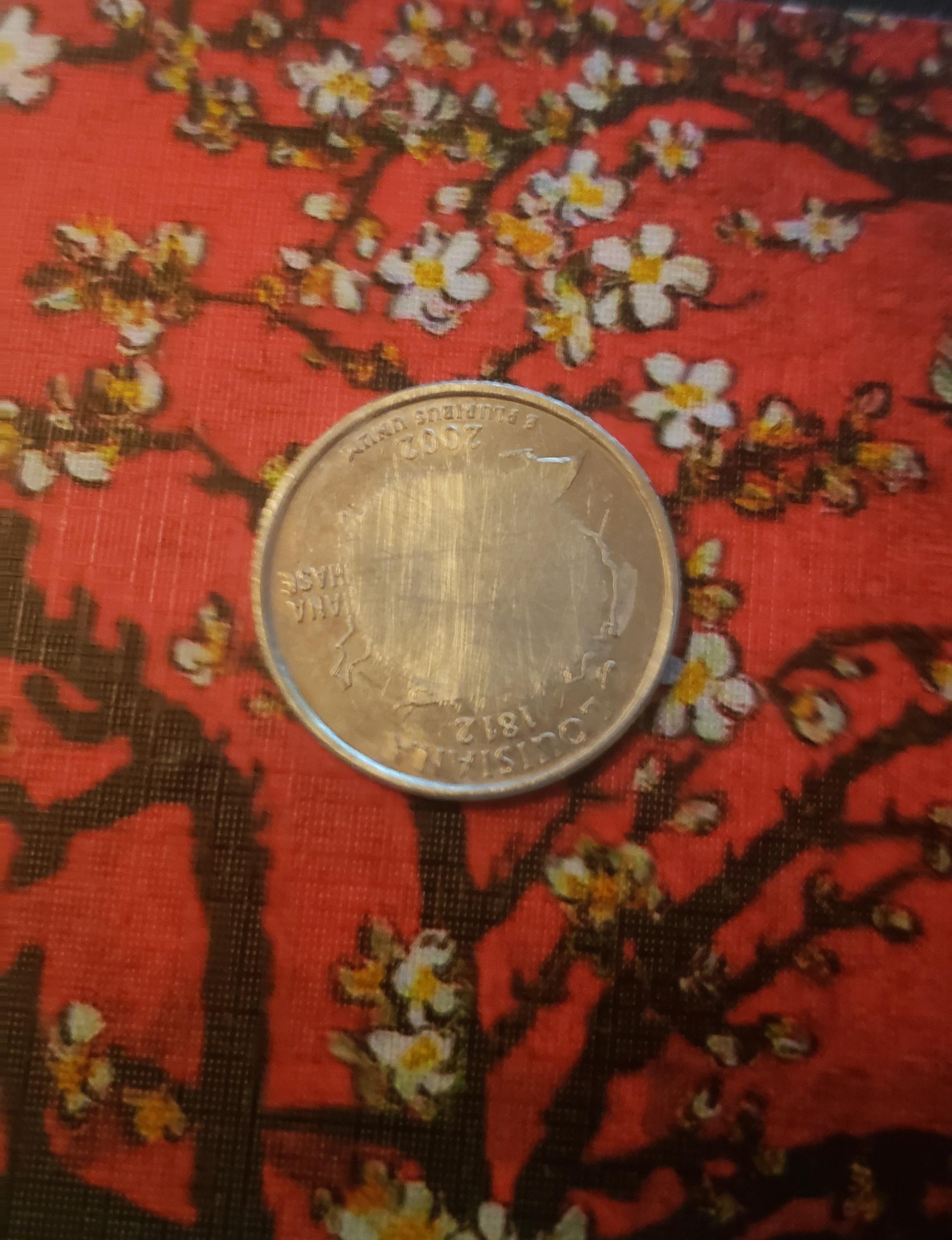 I found this quarter stuck in the bottom of my washing machine. r