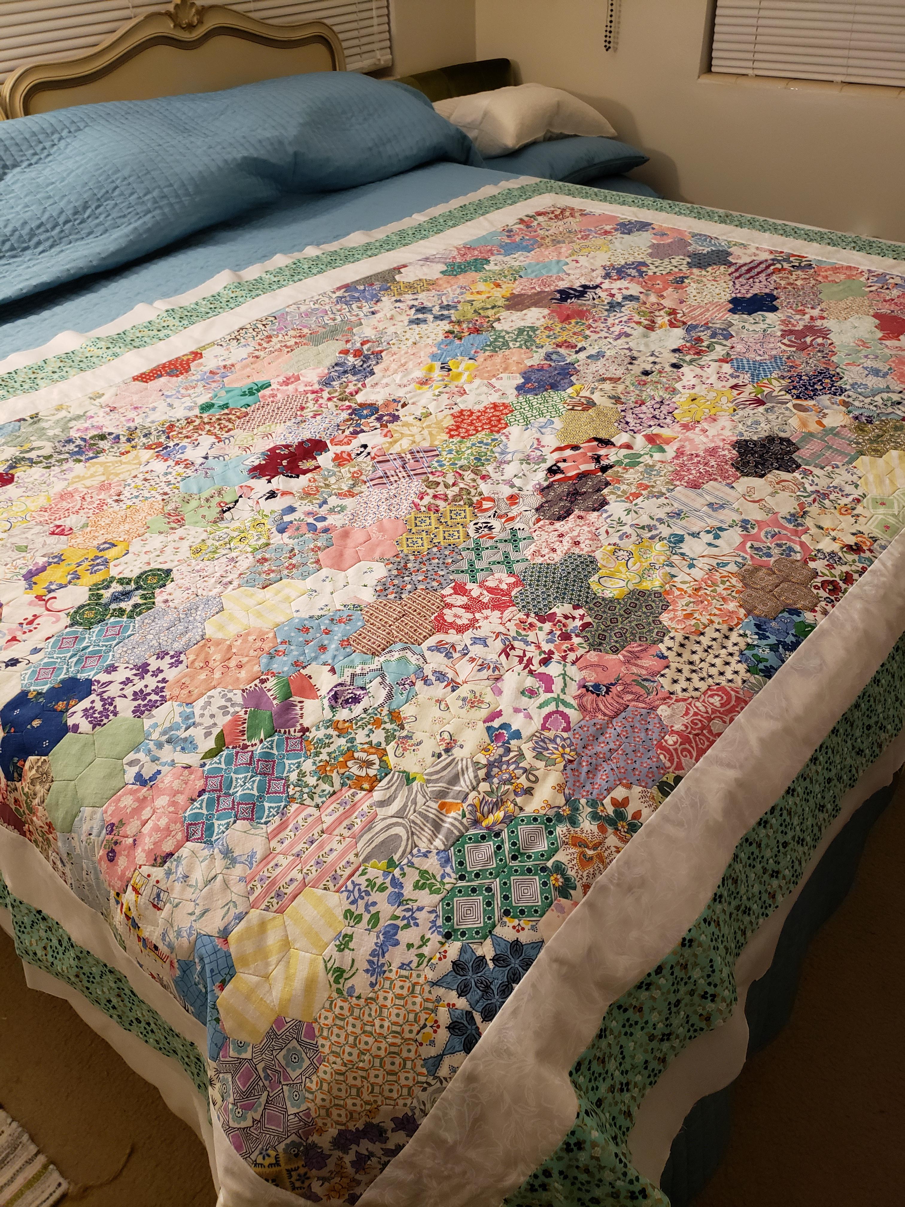 Hand stitched EPP/hexie quilt from (mostly) vintage fabrics, finished