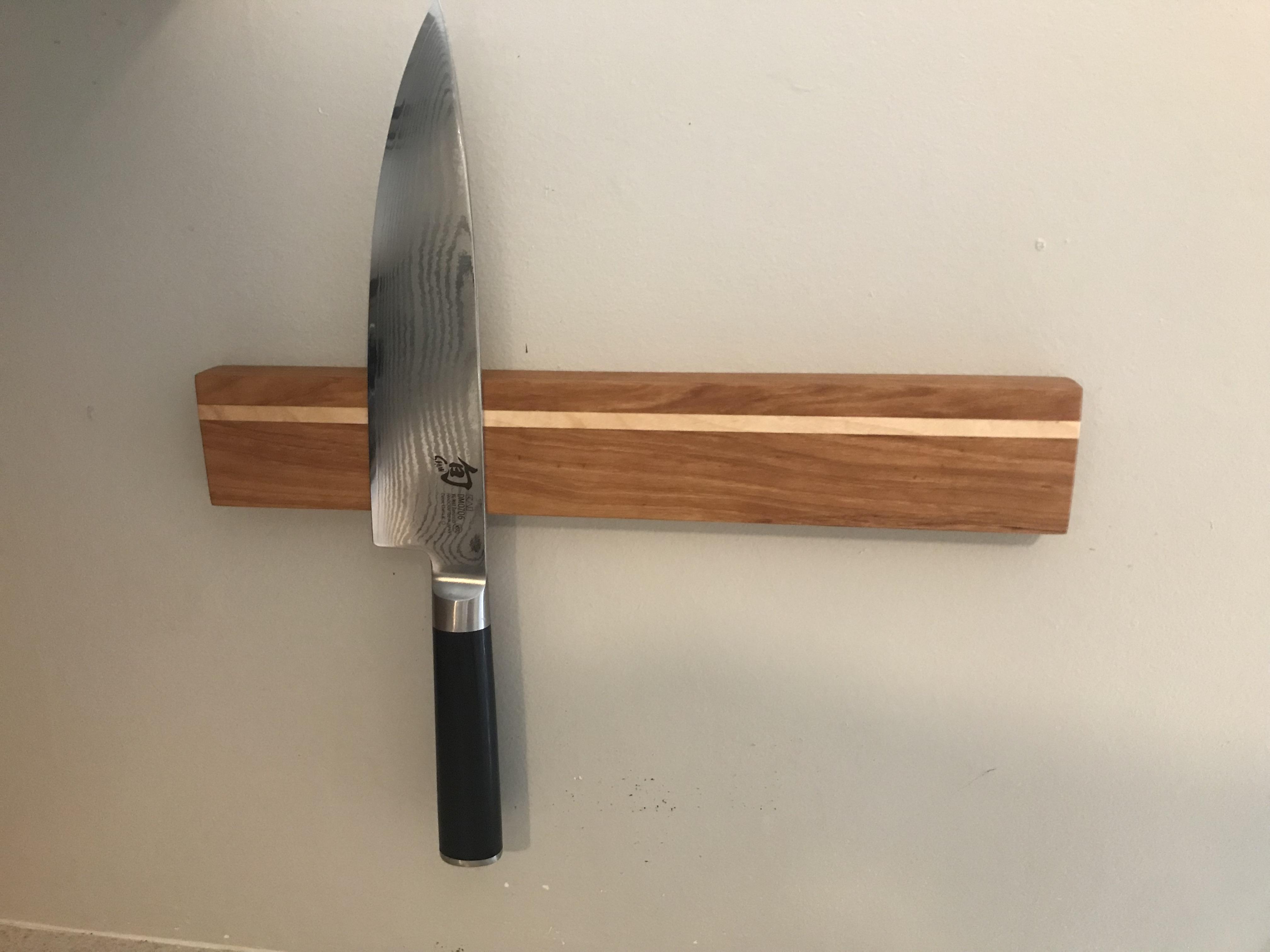 Simple knife rack I made of cherry and walnut with the embedded