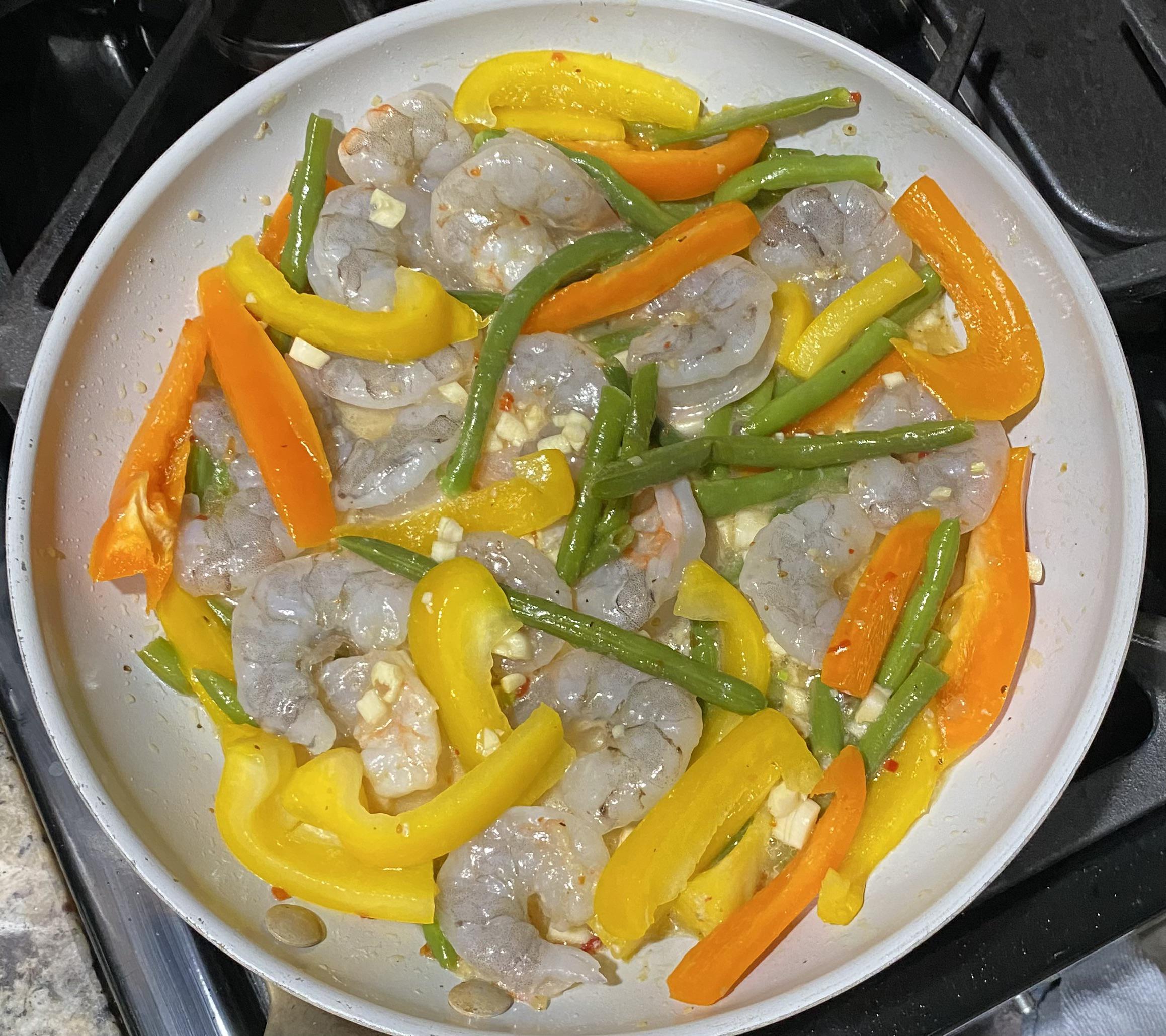 Shrimp, bell pepper, and green beans cooked in Ken’s Zesty Italian