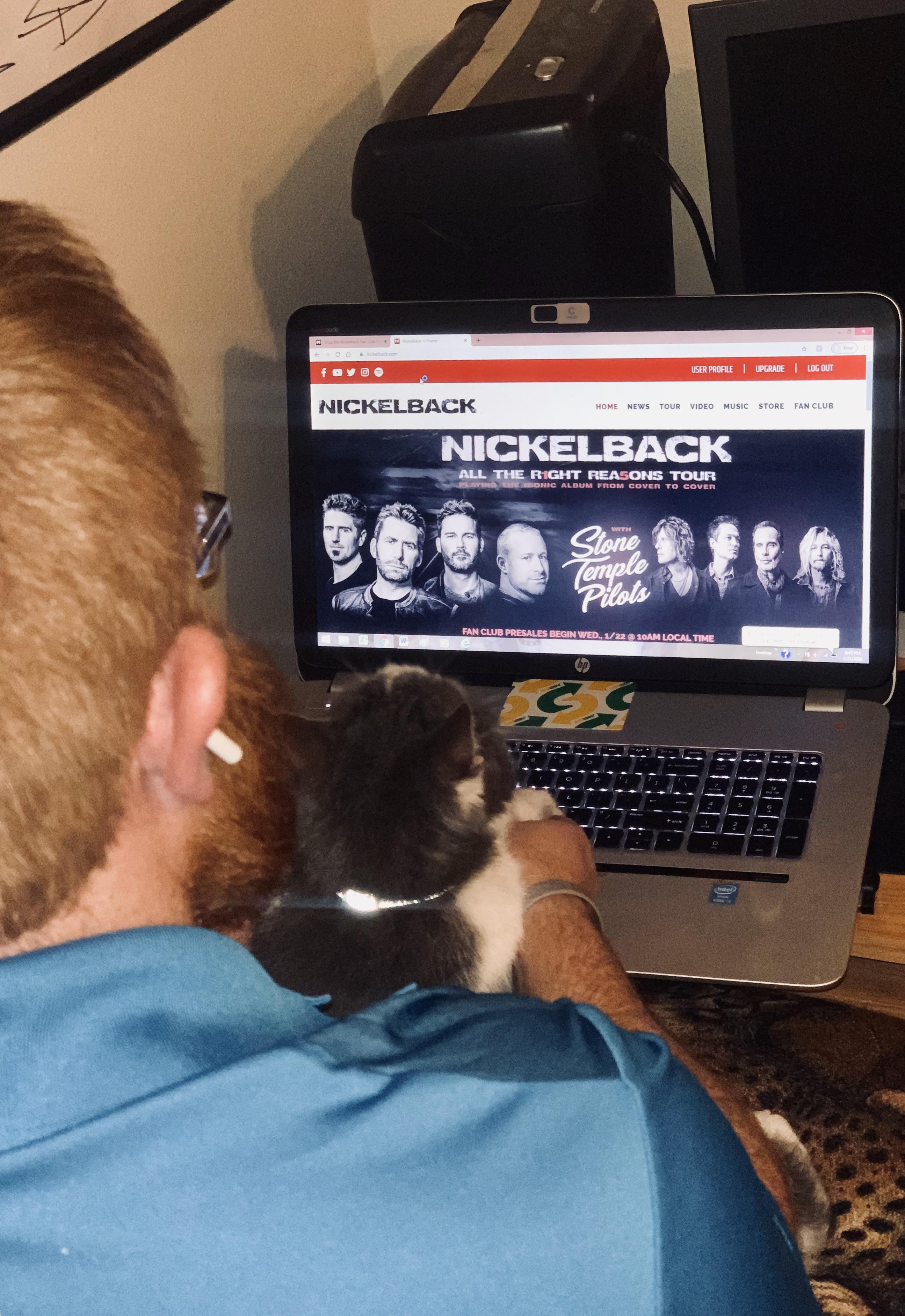 Teaching Harry how to join the Nickelback fan club. Gotta get that presale code. pics