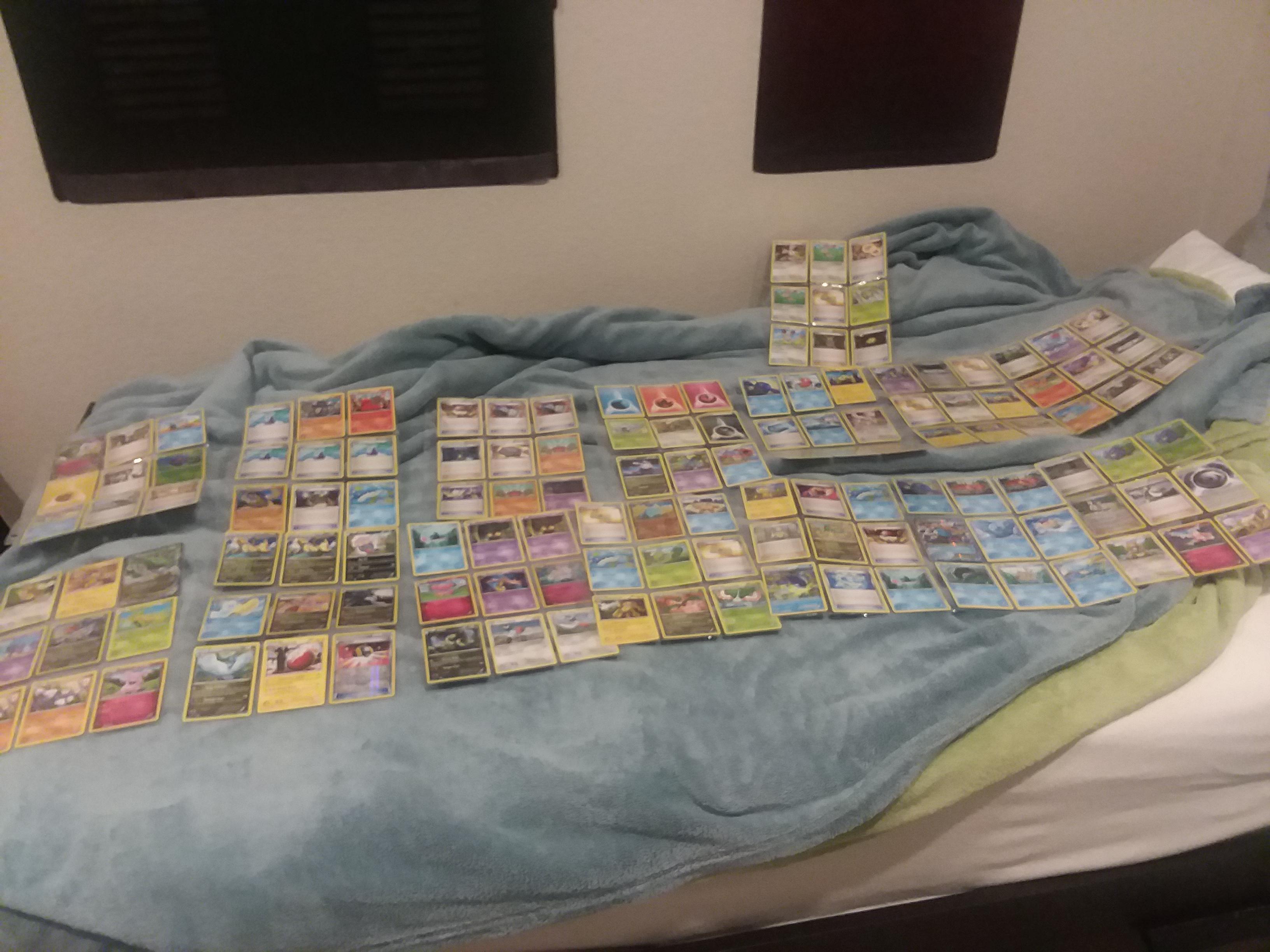 A horrible photo of my giant pokemon card collection. Questions