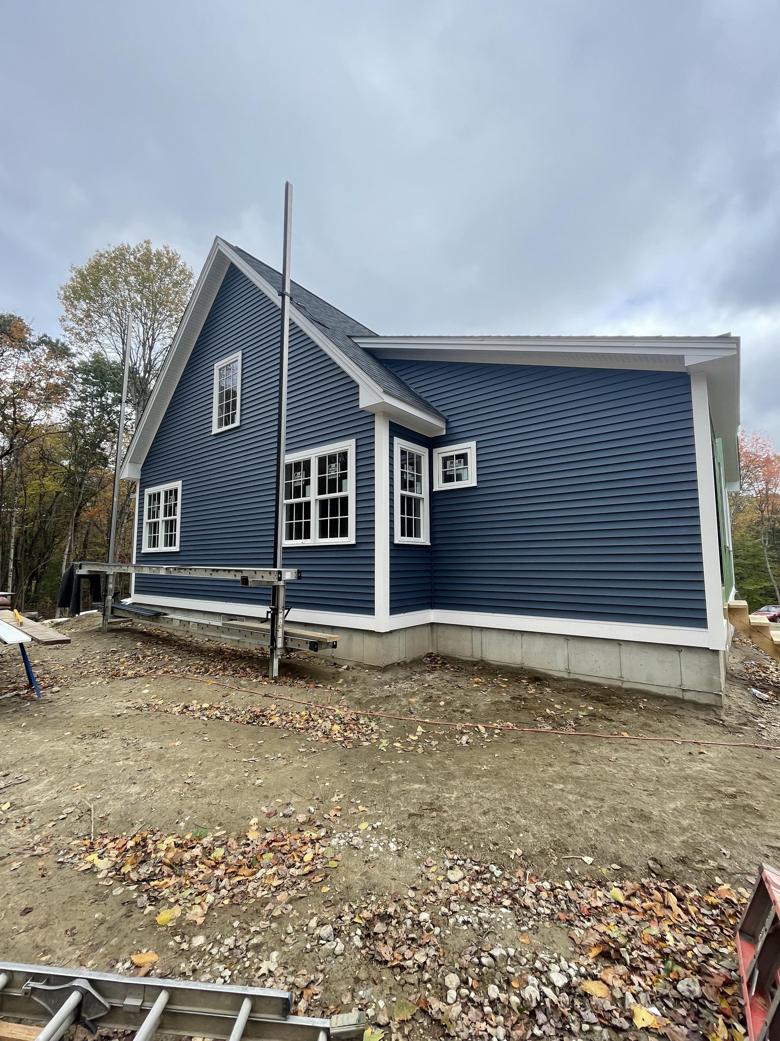 Our current build. Vinyl siding, aluminum rake/fascia trim, versatex
