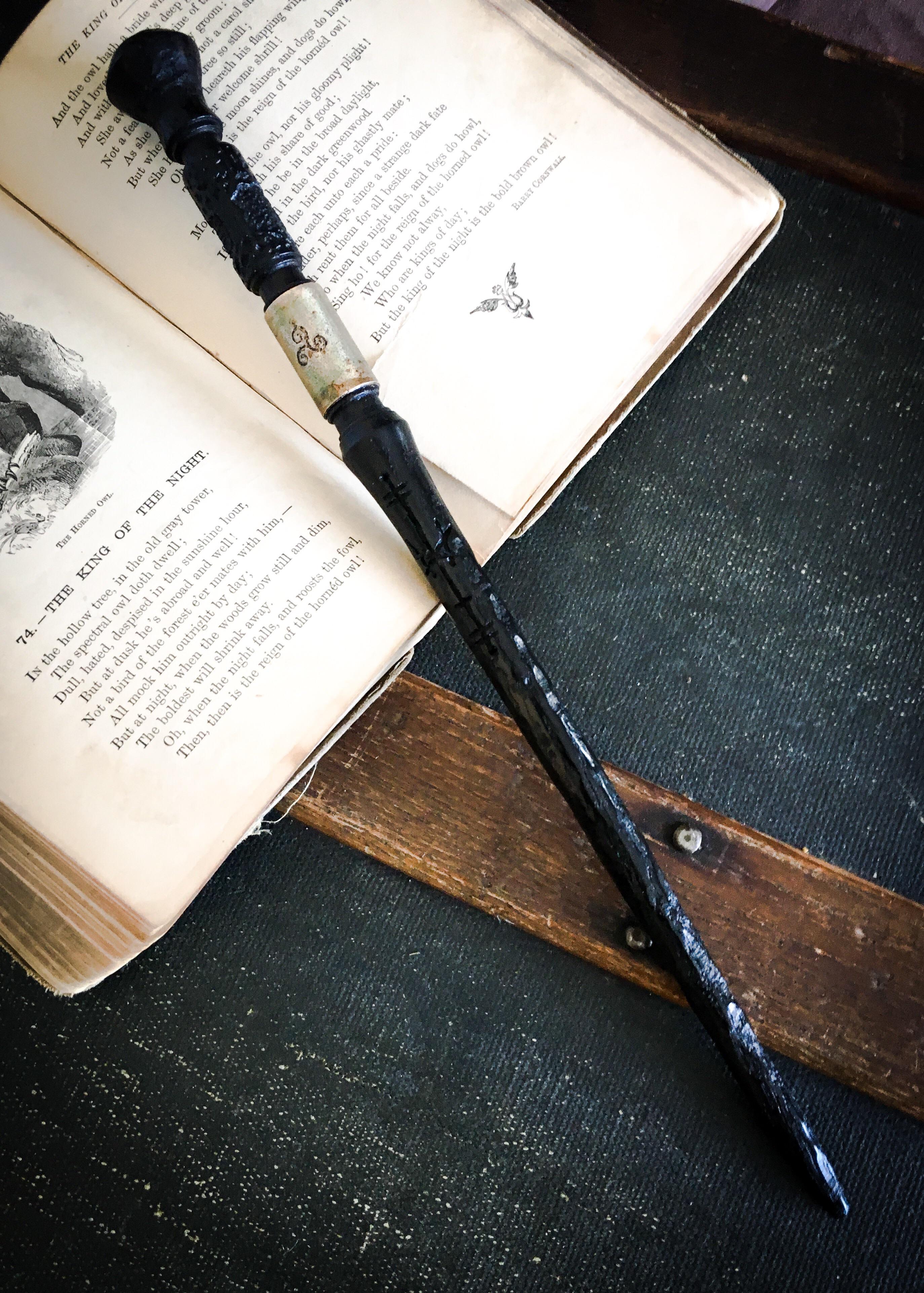 A Windermere wand carved of 4000 year old Morta with antiqued bronze
