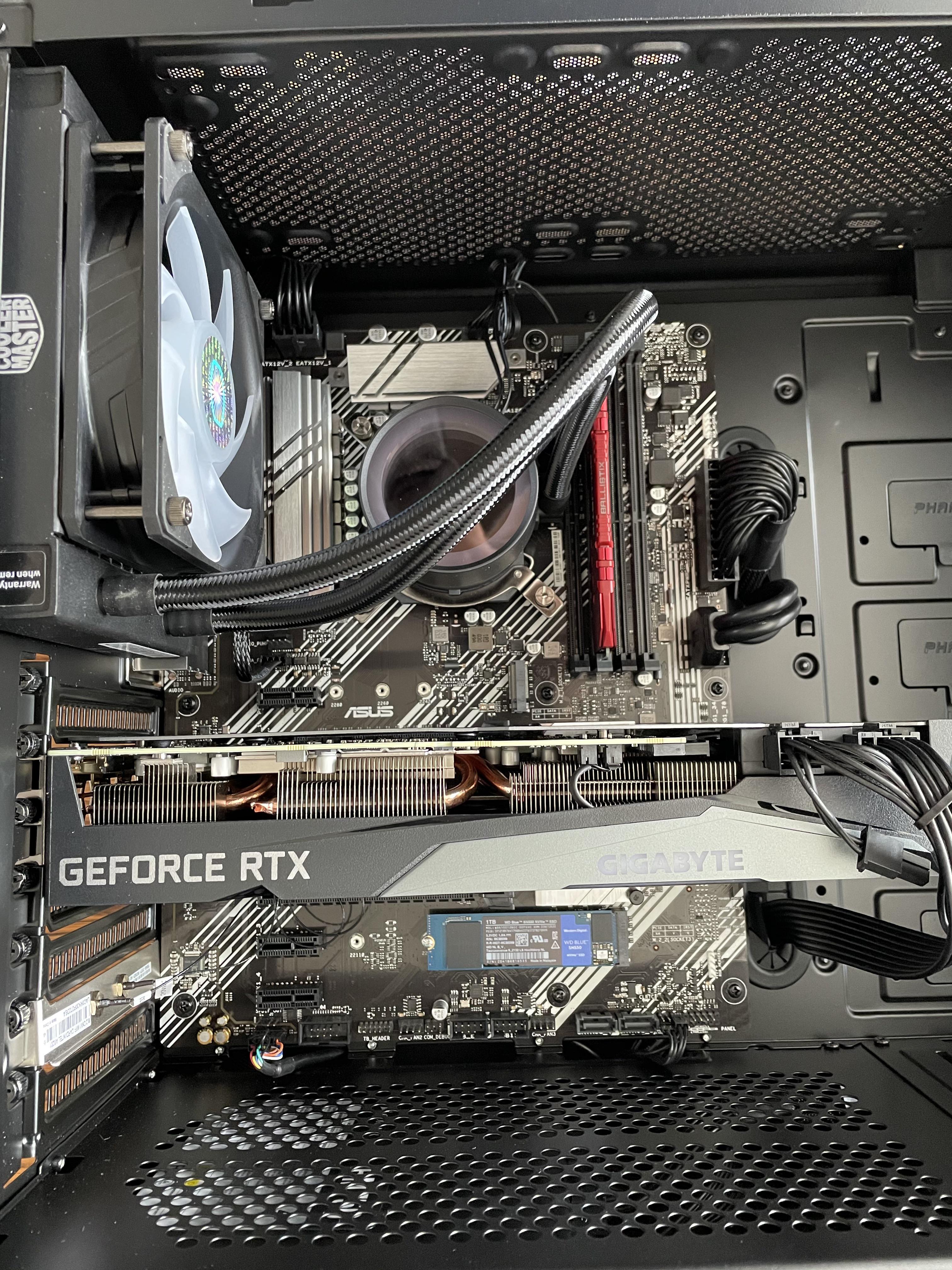 Here she is right out of the box! I replaced the ram and water cooler