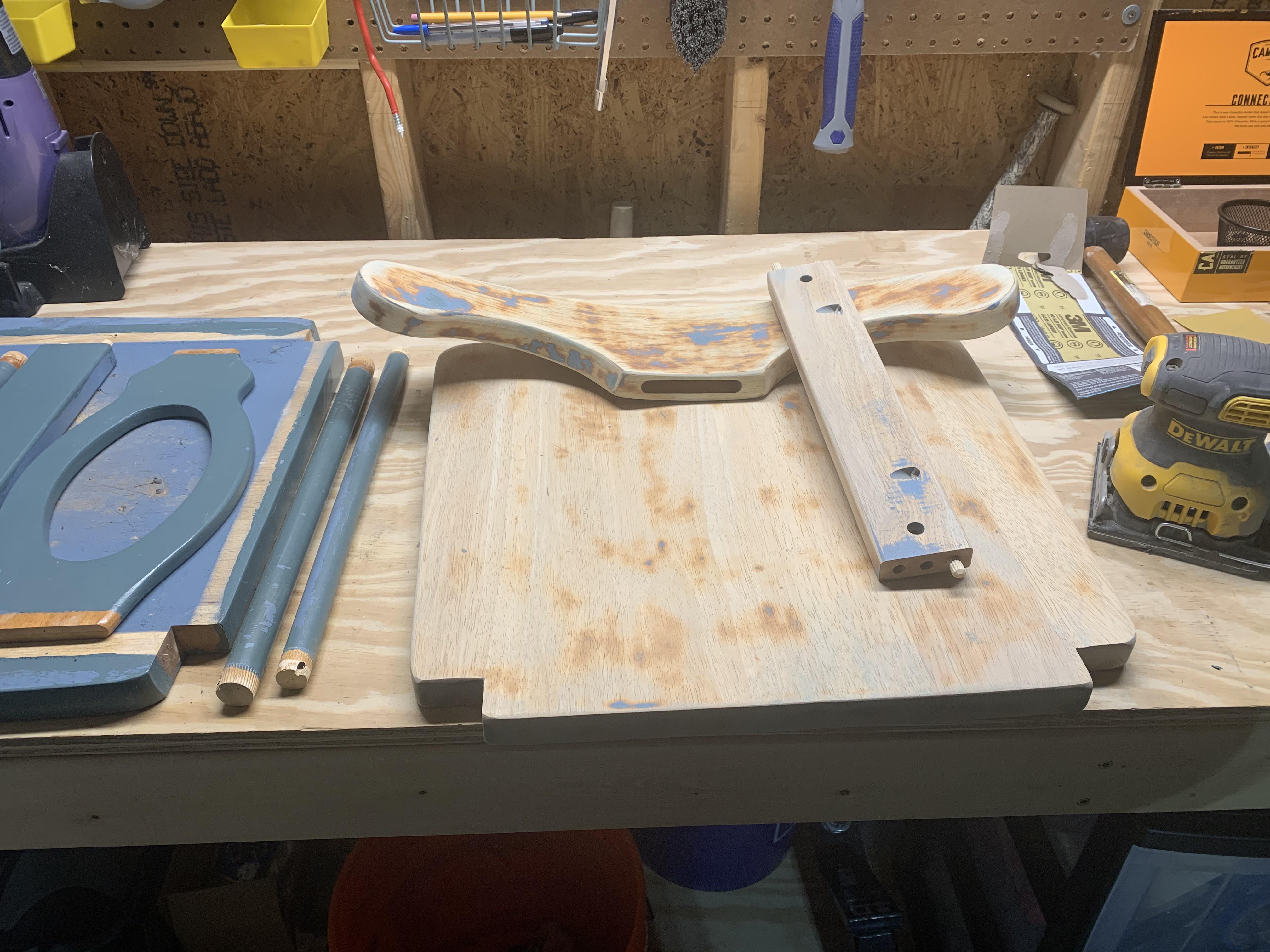 Taking apart chairs and sanding them down so we can paint them for the