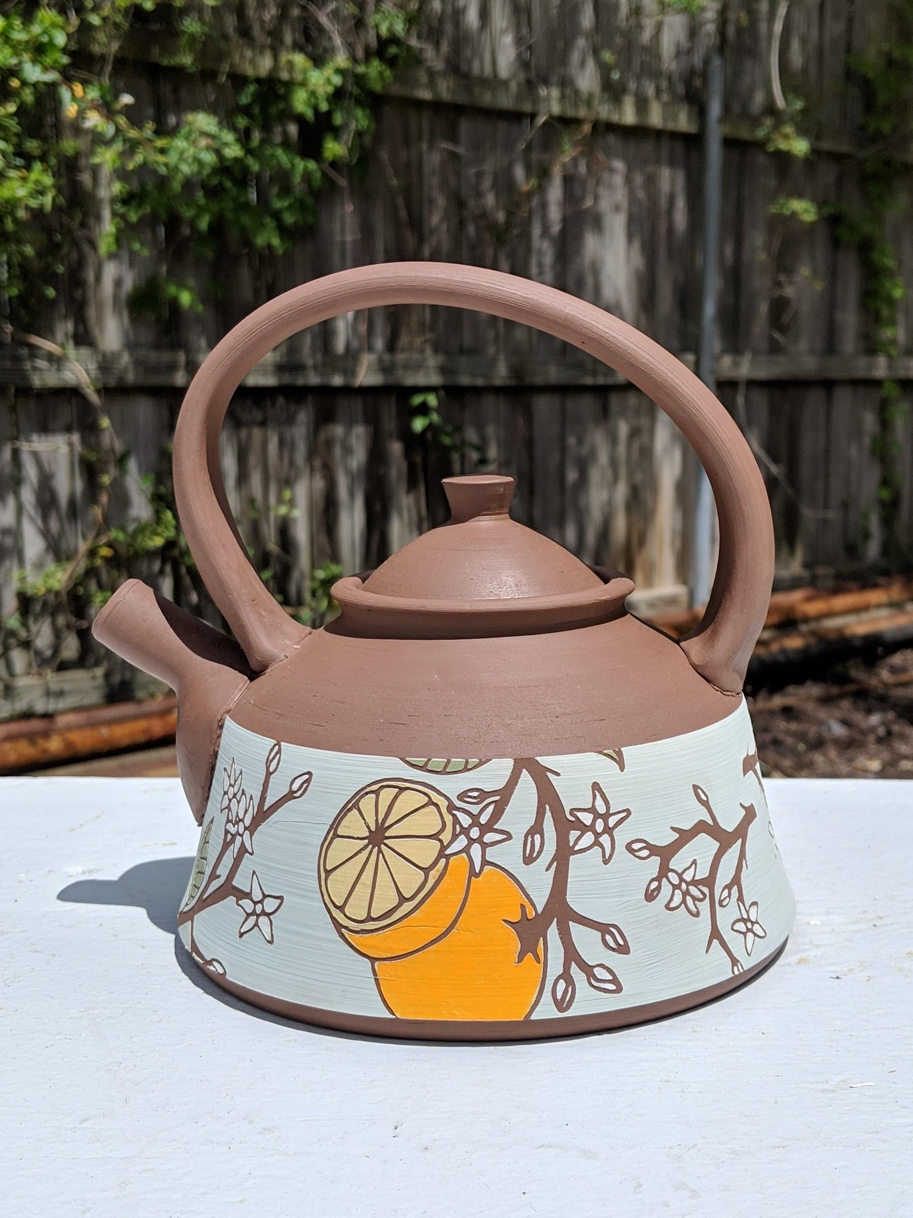 This teapot is headed for a bisque firing. r/Pottery