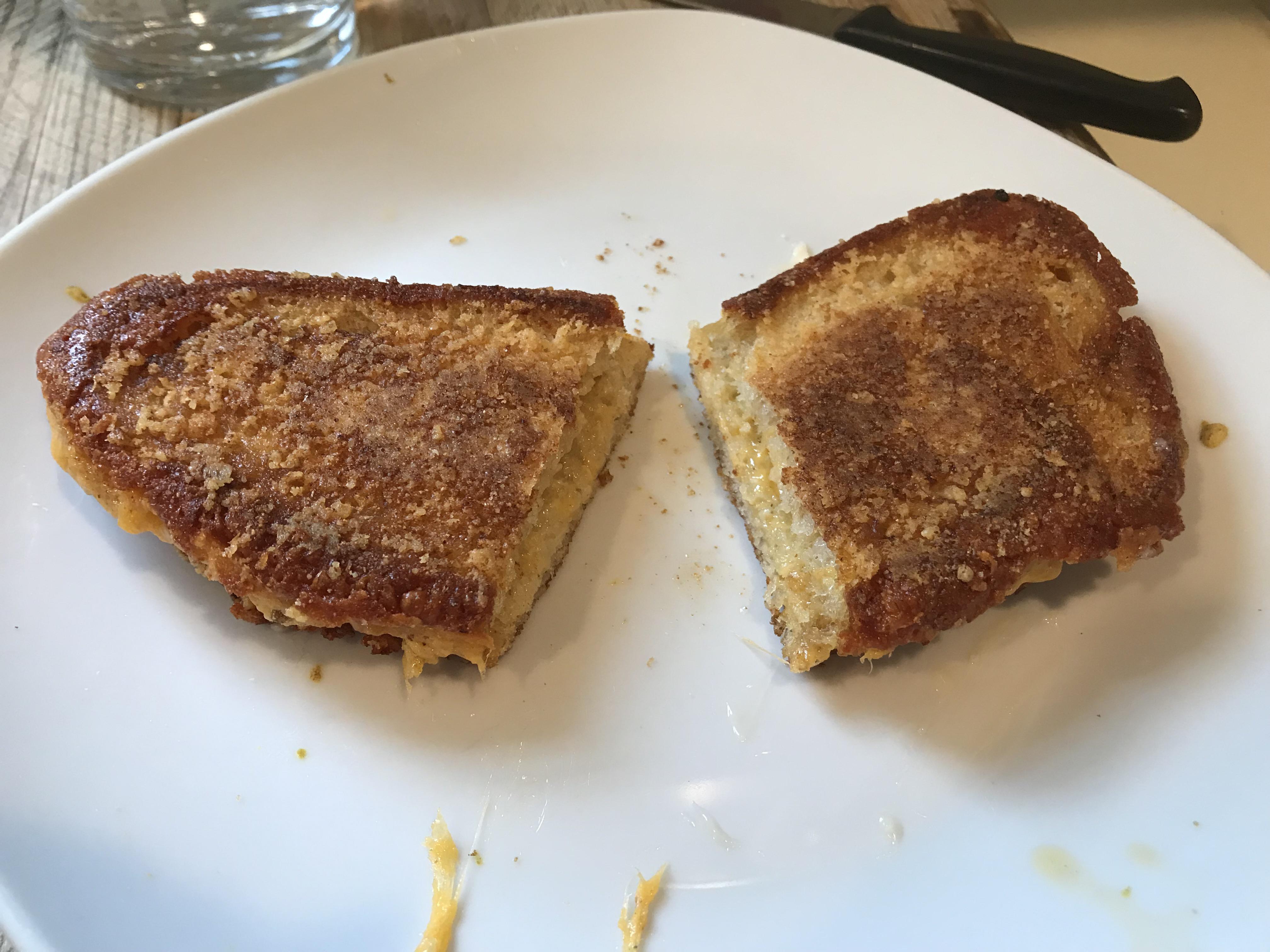 Grilled cheese. Made in cast iron with Parmesan cheese crust. Inside is cheddar mayo, mustard