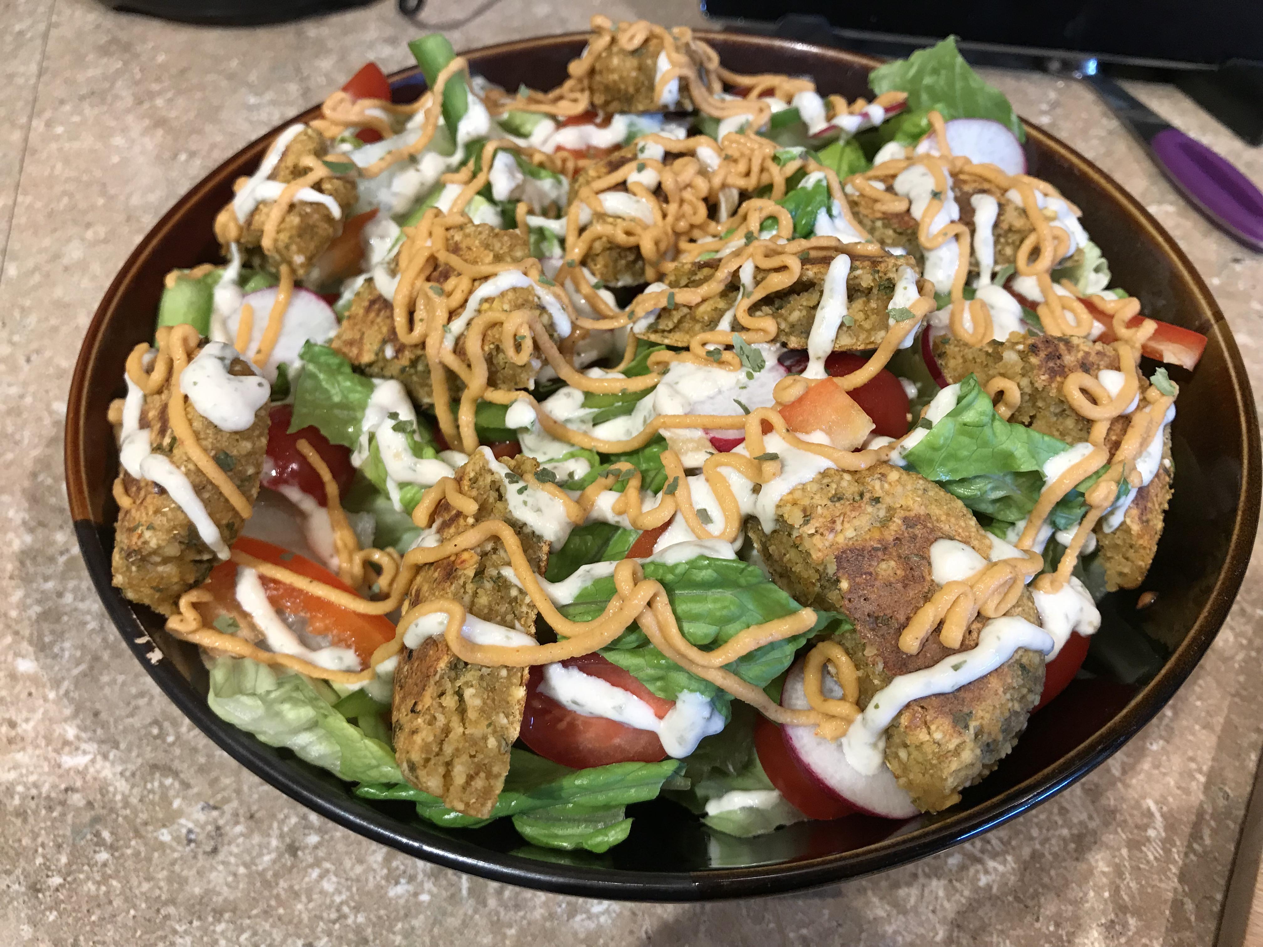 281 Calorie Lunch Falafel Salad w/ spicy hummus & tahini dresssing