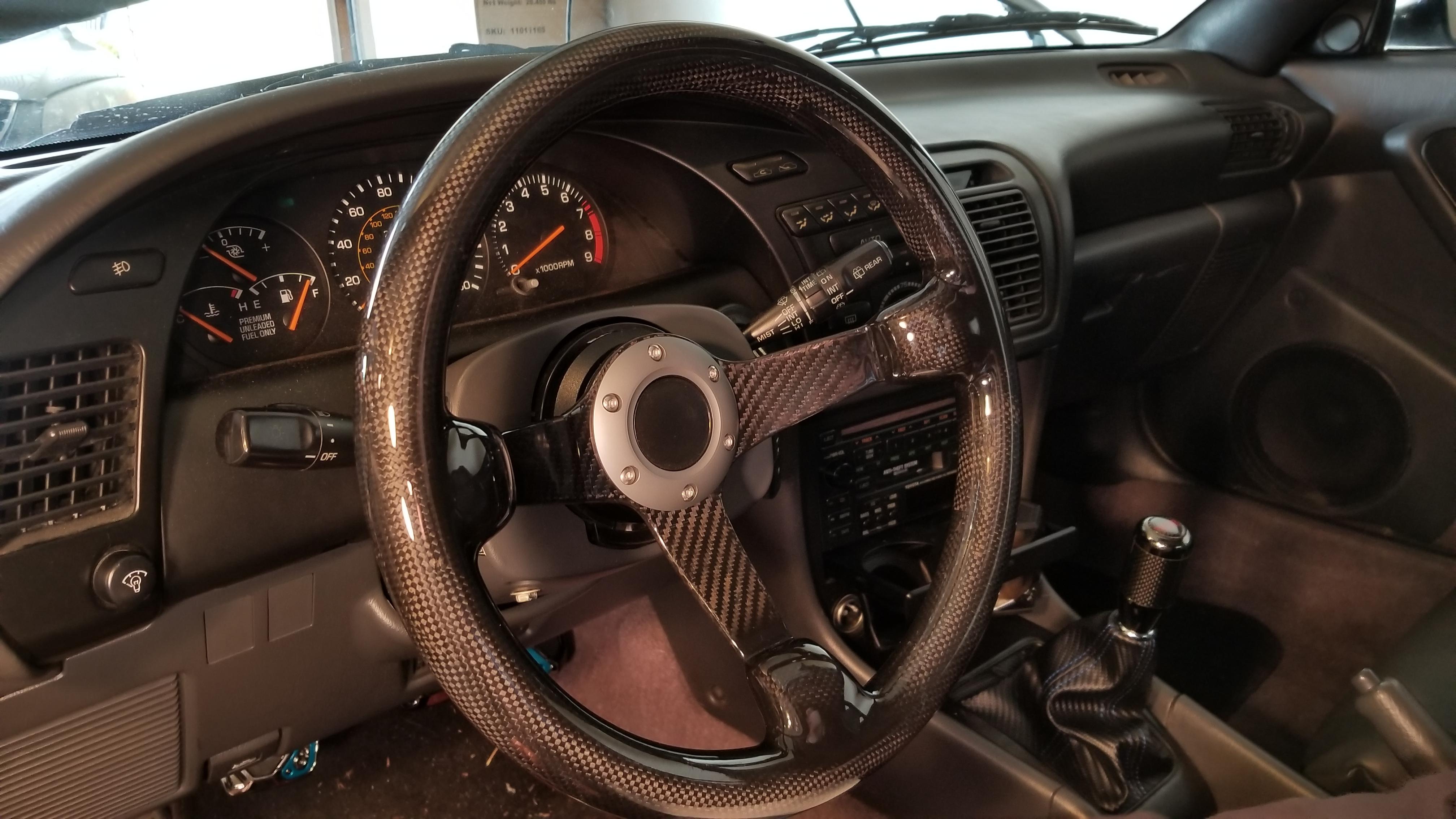 All carbon fiber steering wheel in the 91. NRG wheel hub. Wheel weighs