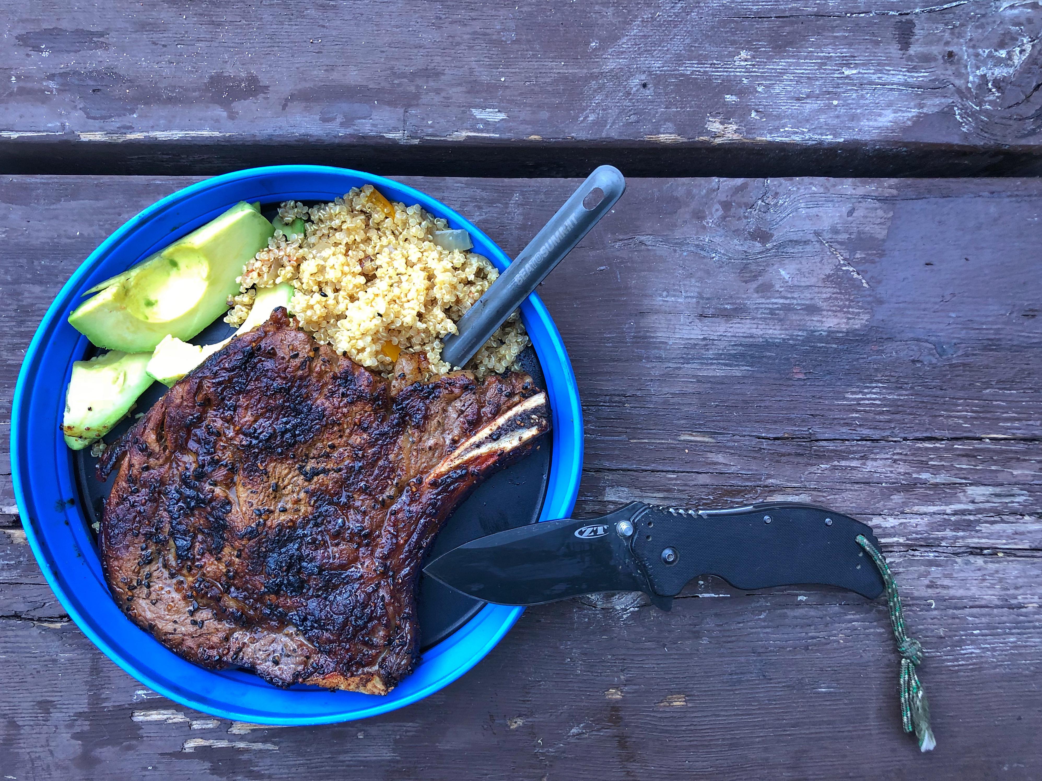 Bonein Ribeye/ Avacado slices / quinoa with onions and peppers r