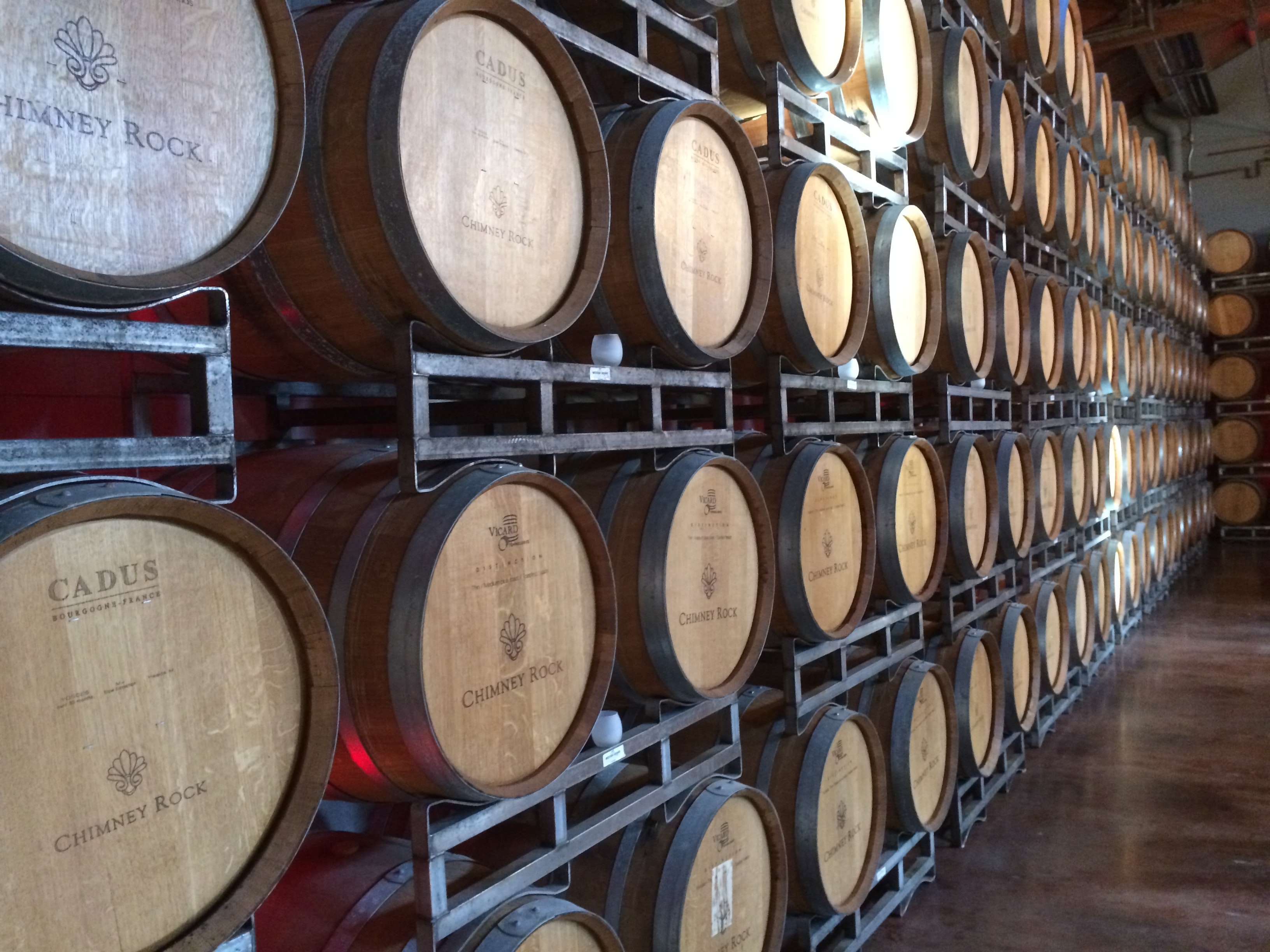 Chimney Rock wine barrels are stored in a perfect line to preserve the