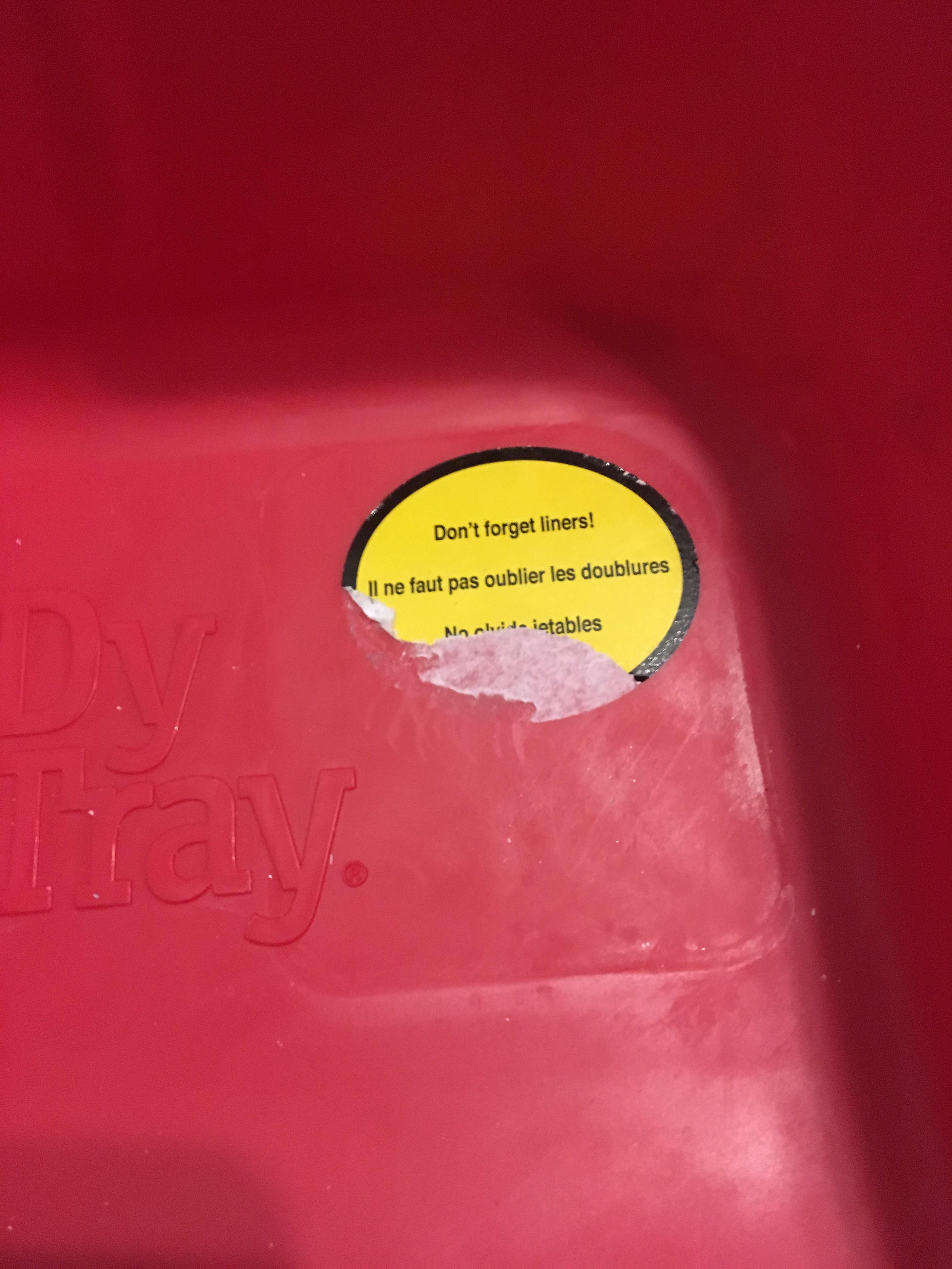 The sticker on the paint tray won't peel off. If you pour paint over it