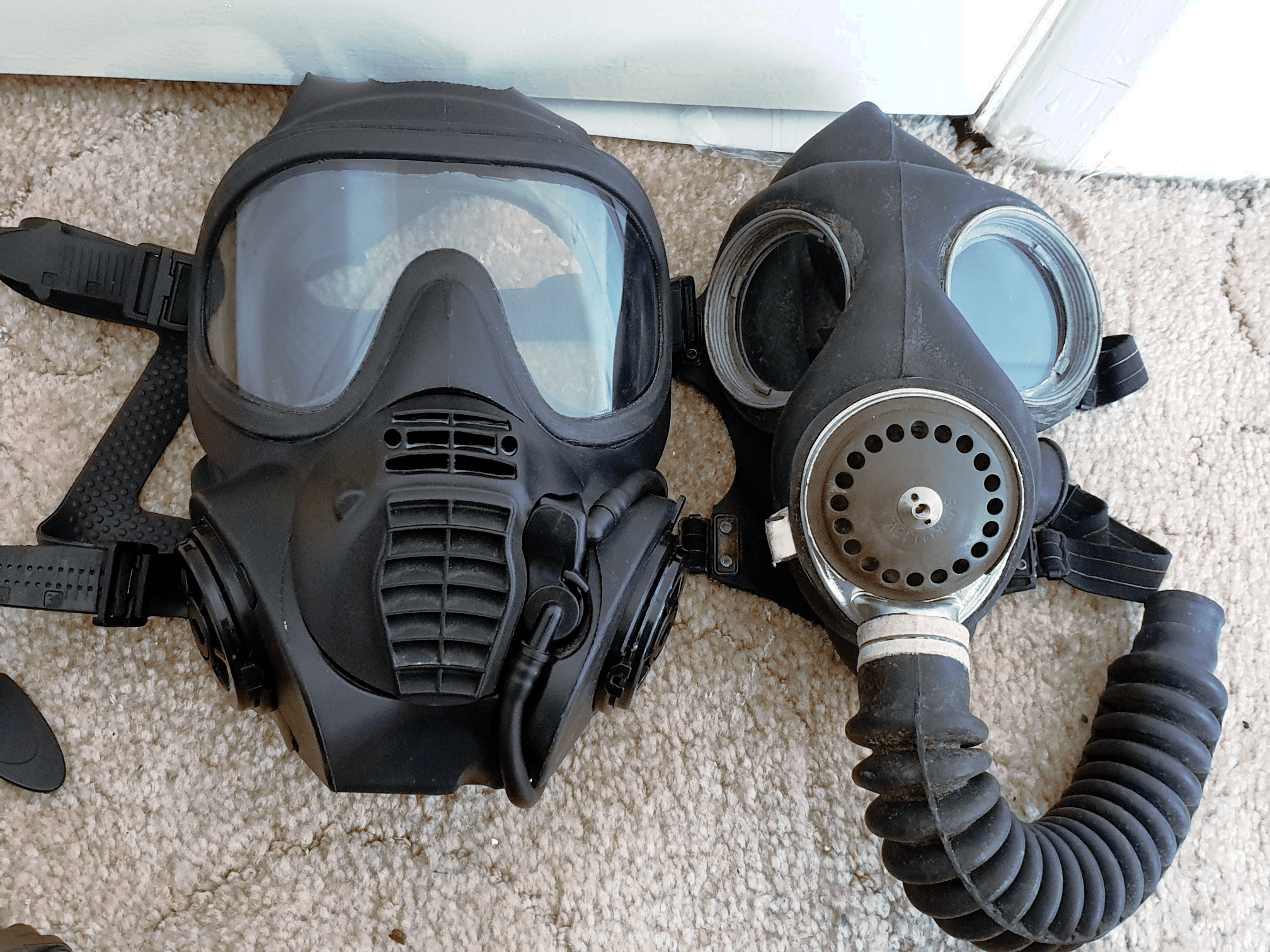 Two generations of British GSR masks on the left, the modern General