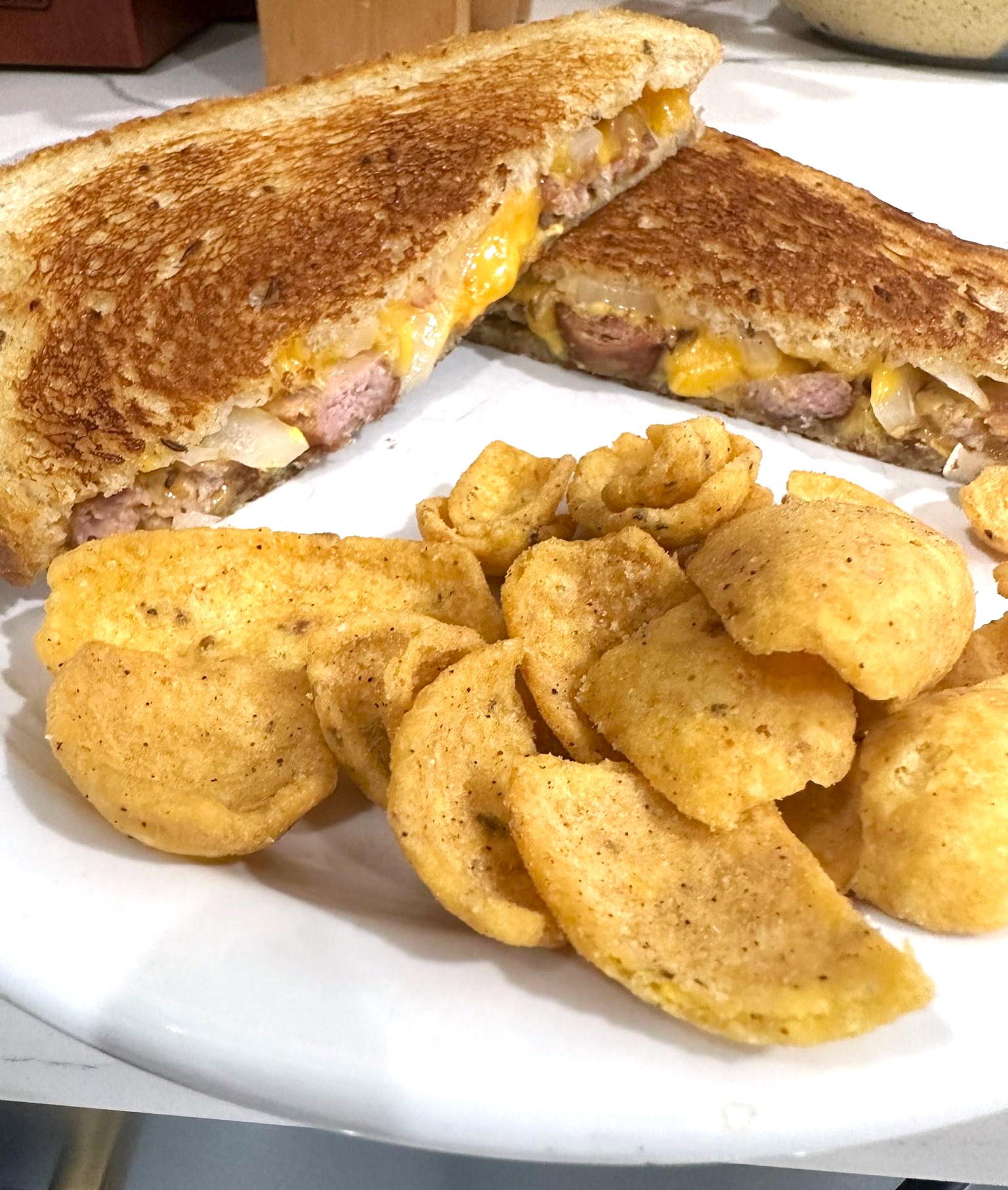 [homemade] beer brat grilled cheese brat, vermont cheddar, onion and