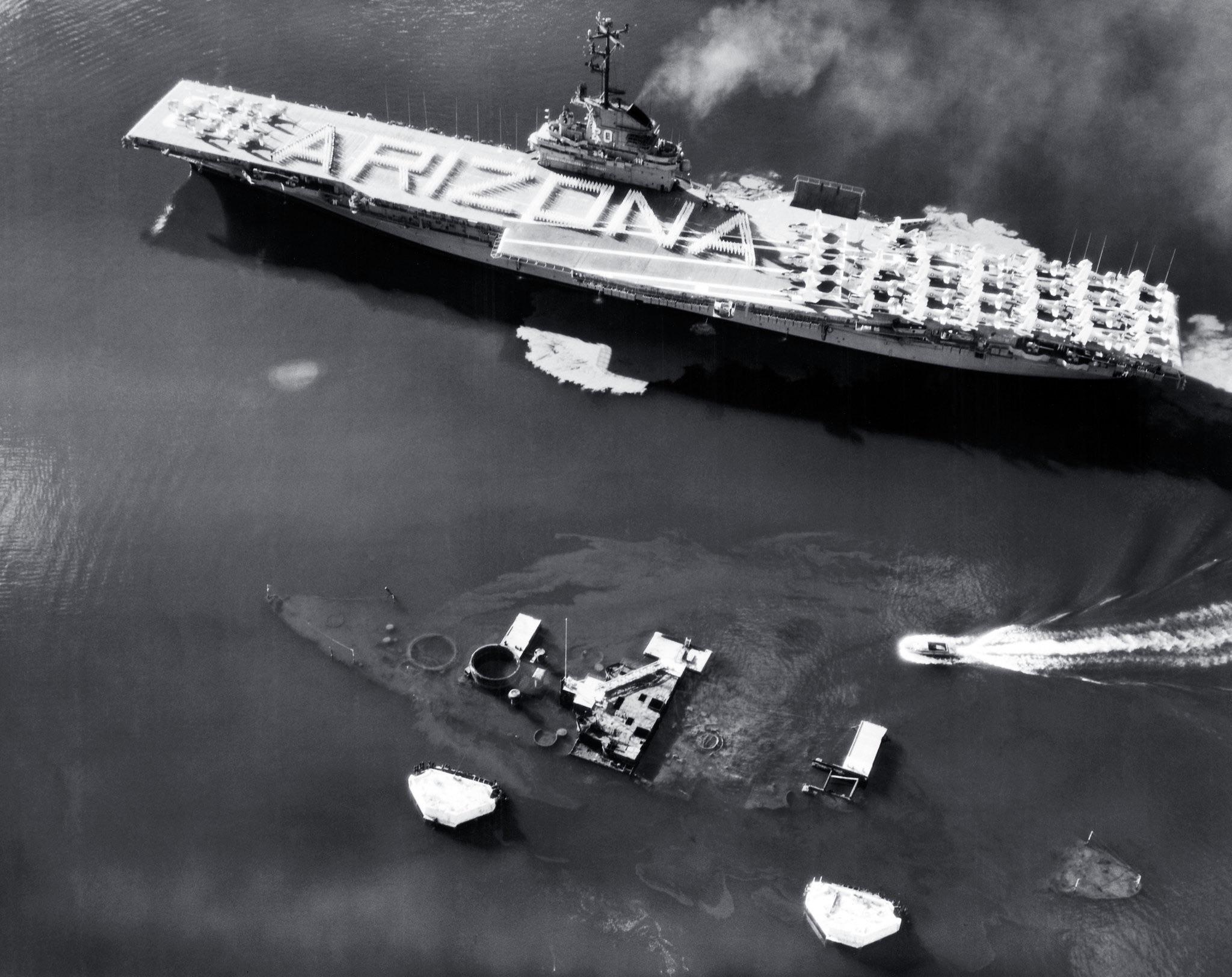 Crew of the USS Bennington honoring the sunken USS Arizona as she