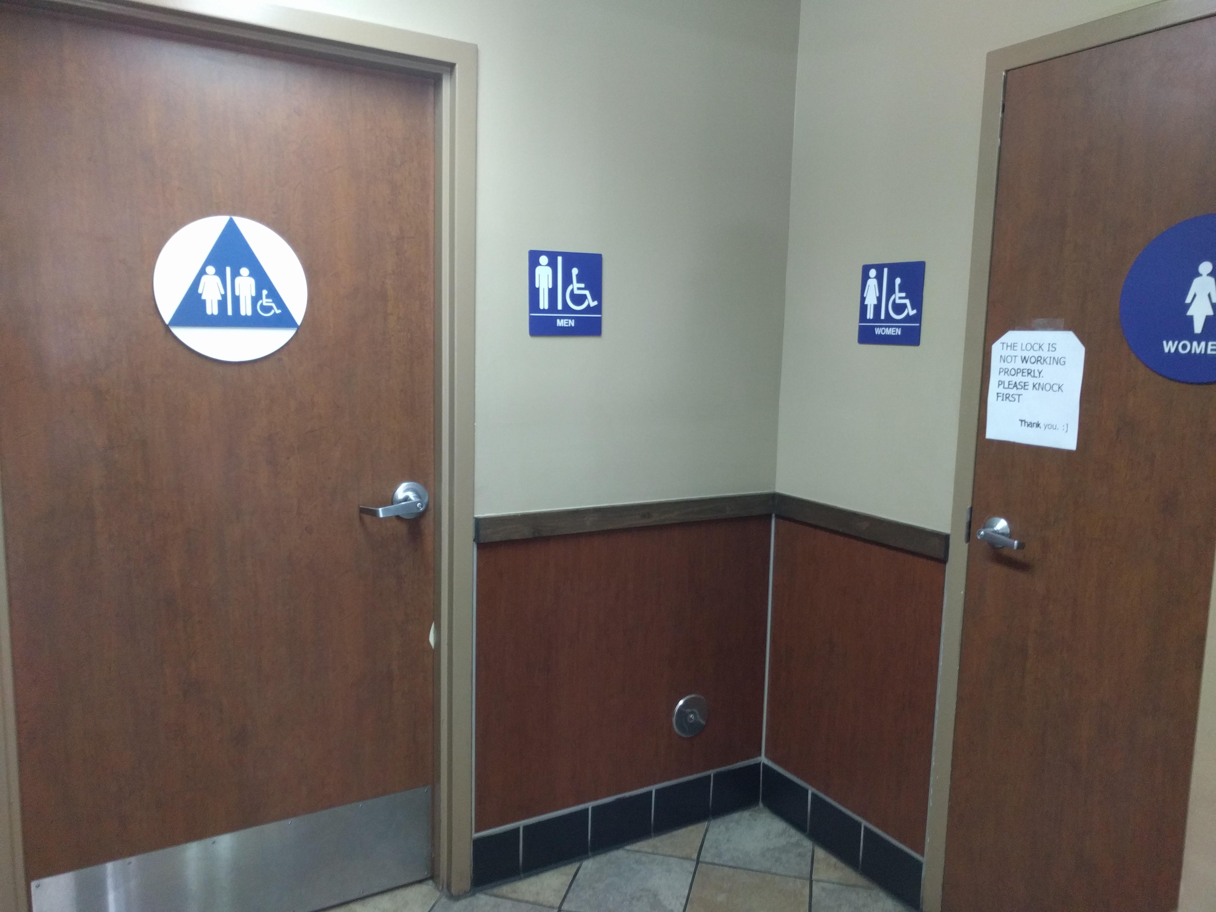 Family restroom. Women's restroom. A SIGN for a men's restroom. r
