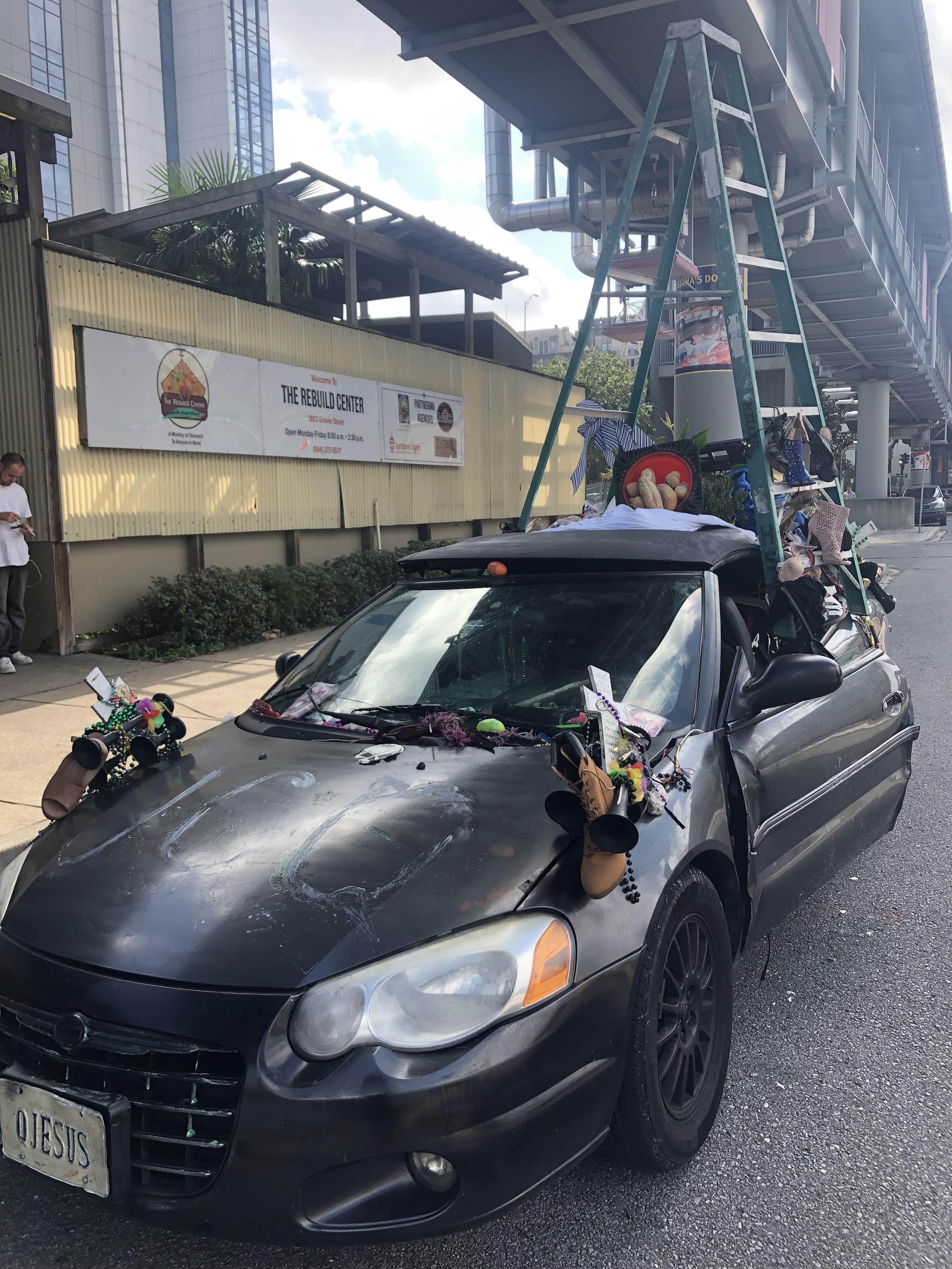 This uniquely decorated car parked in front of a homeless shelter r