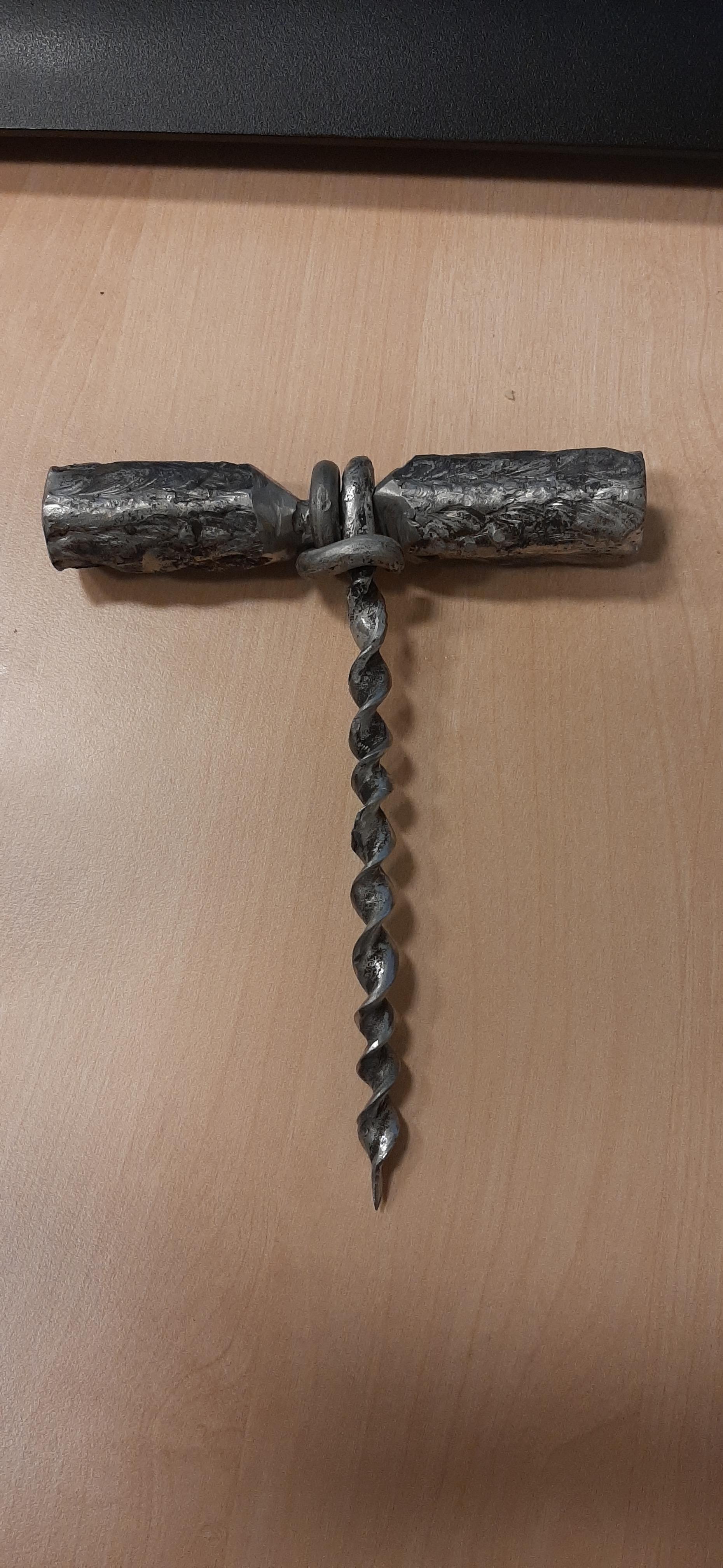 Bored at the graveyard shift, a corkscrew out of stainless steel