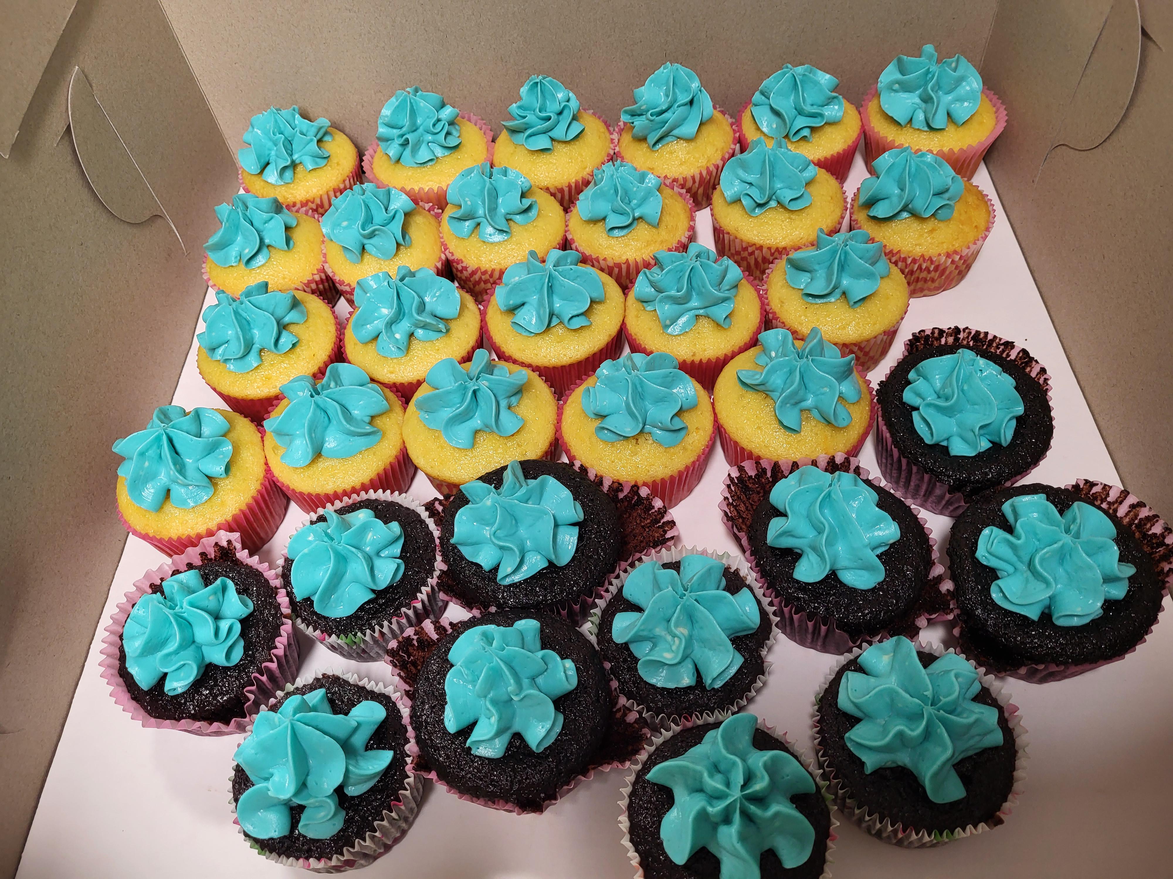 left over baby shower cupcakes. idk why the wrappers are peeling off