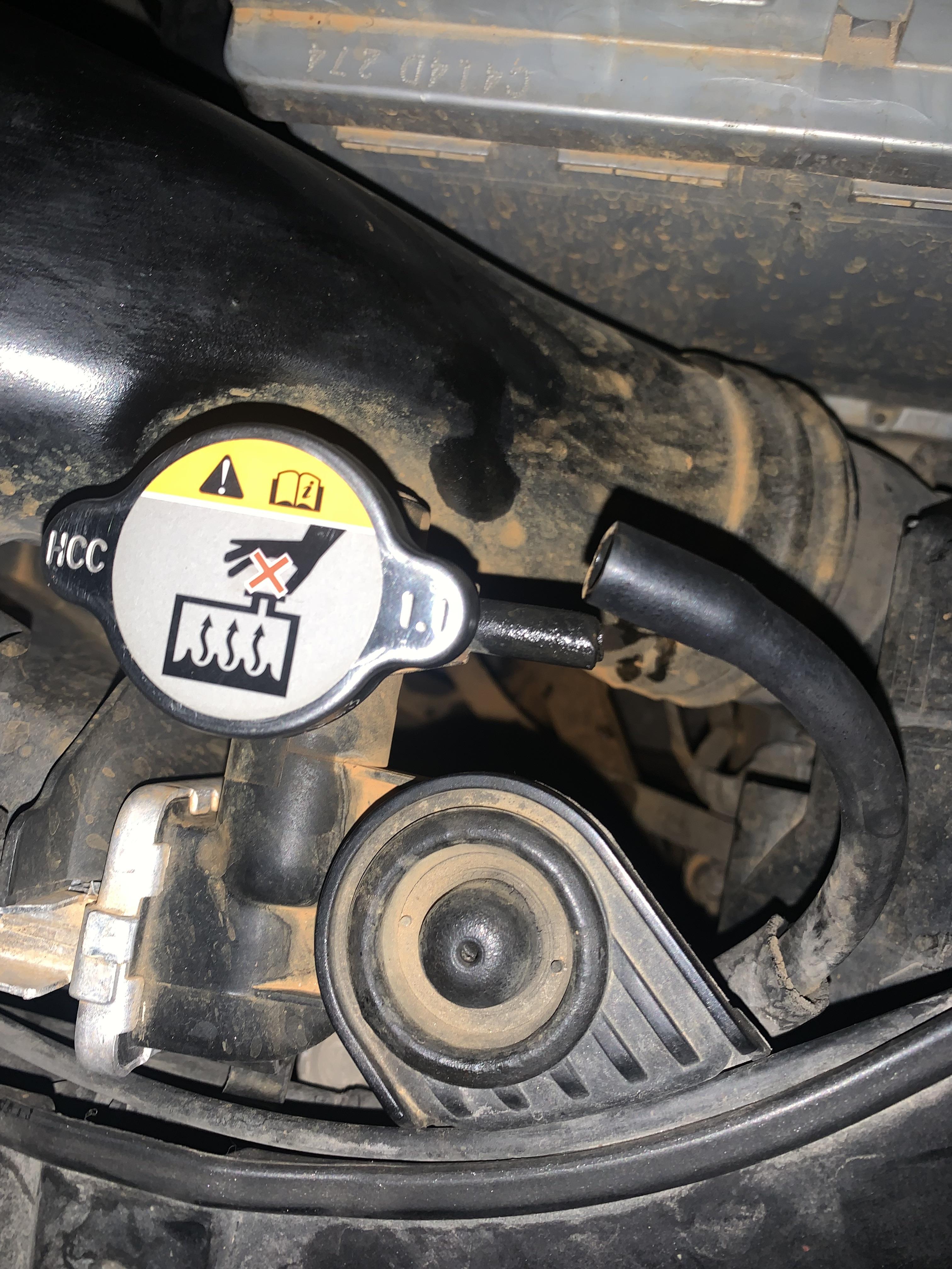 What causes the radiator cap hose to pull out like this after driving