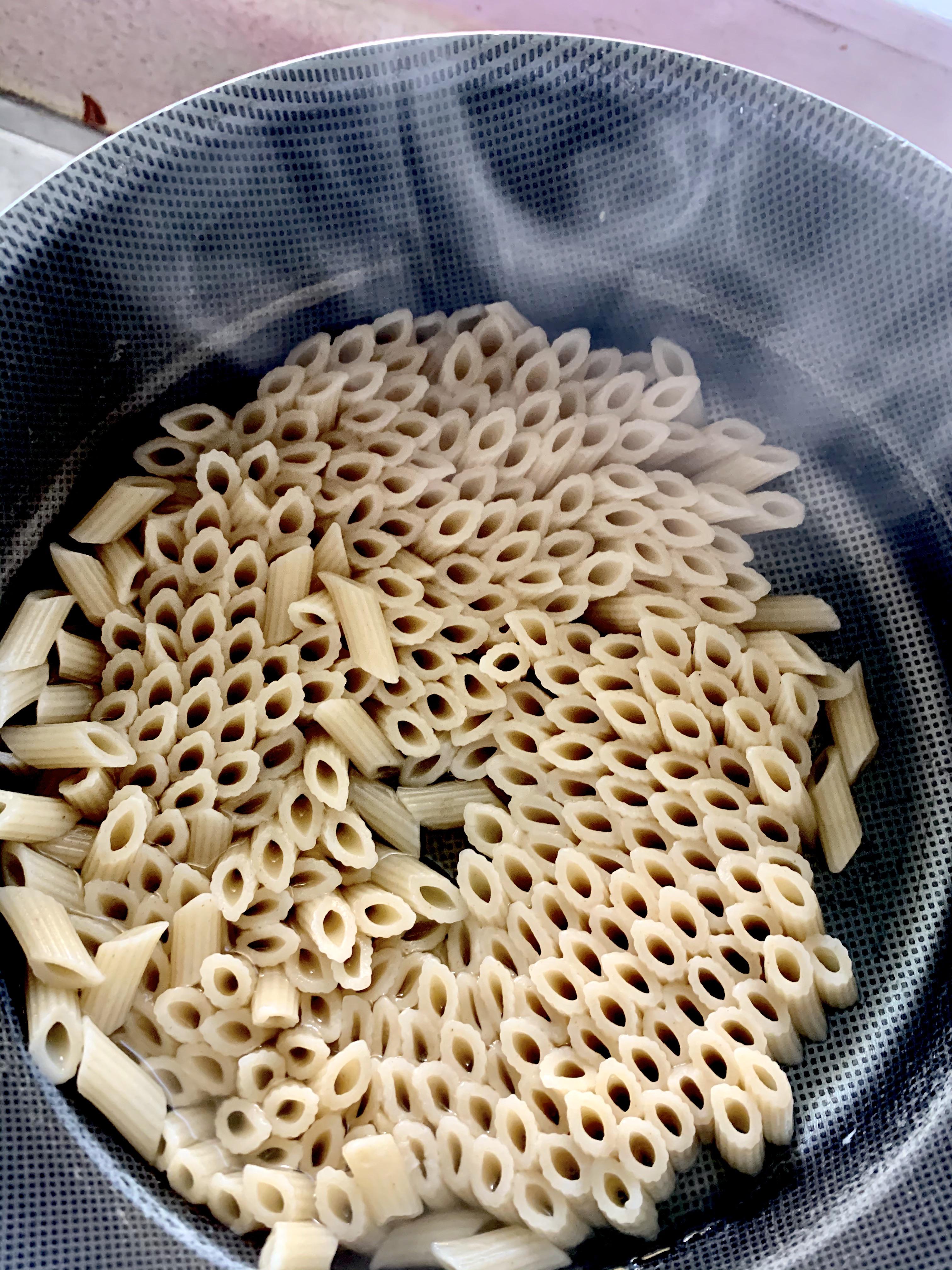Polarized pasta? Whole pot of penne standing up end to end... weird r