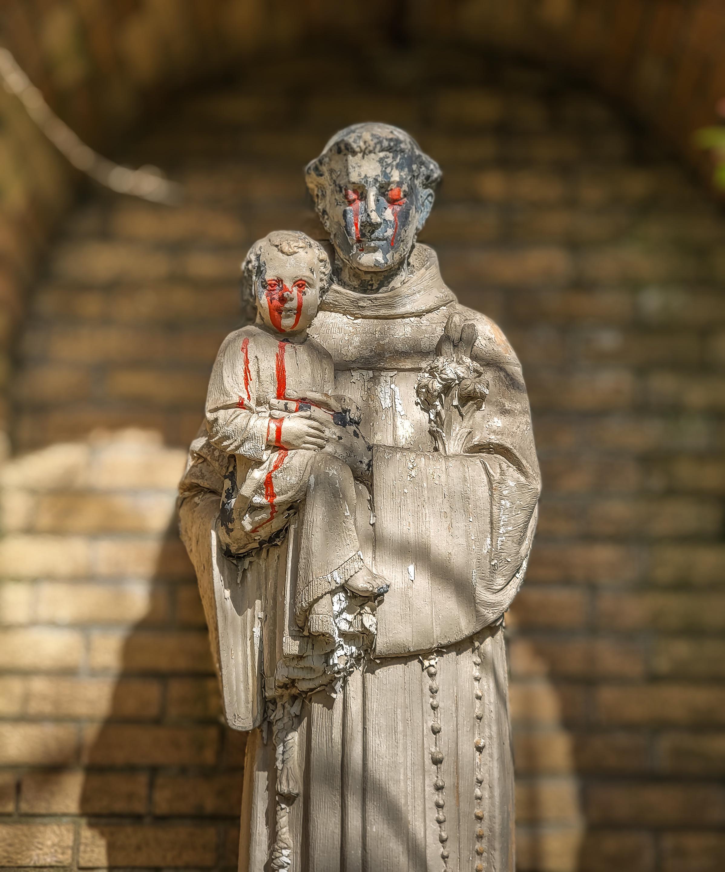 A creepy statue outside an abandoned church! r/AbandonedPorn