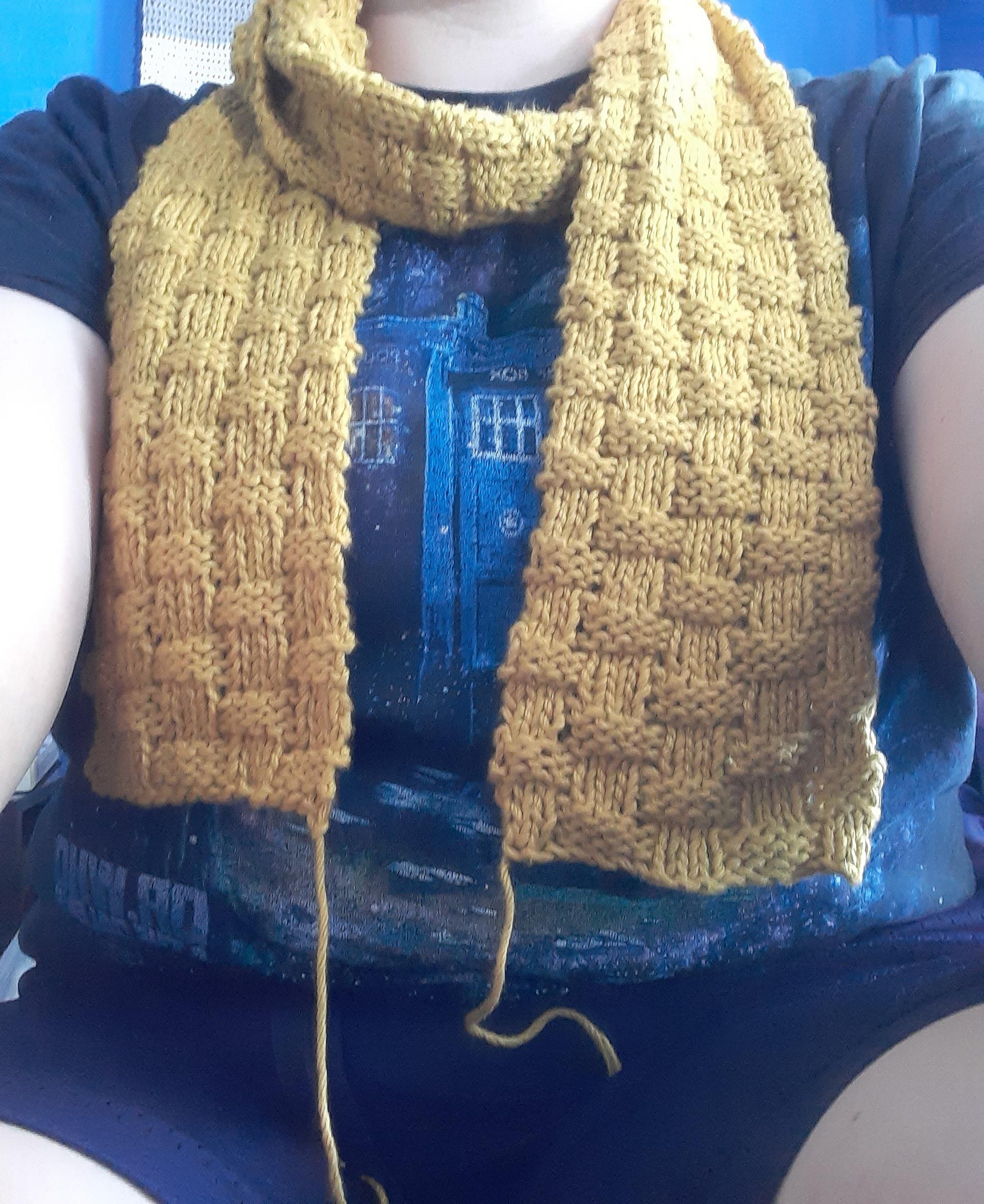my first ever completed knitting project! what do ya'll think fringe or