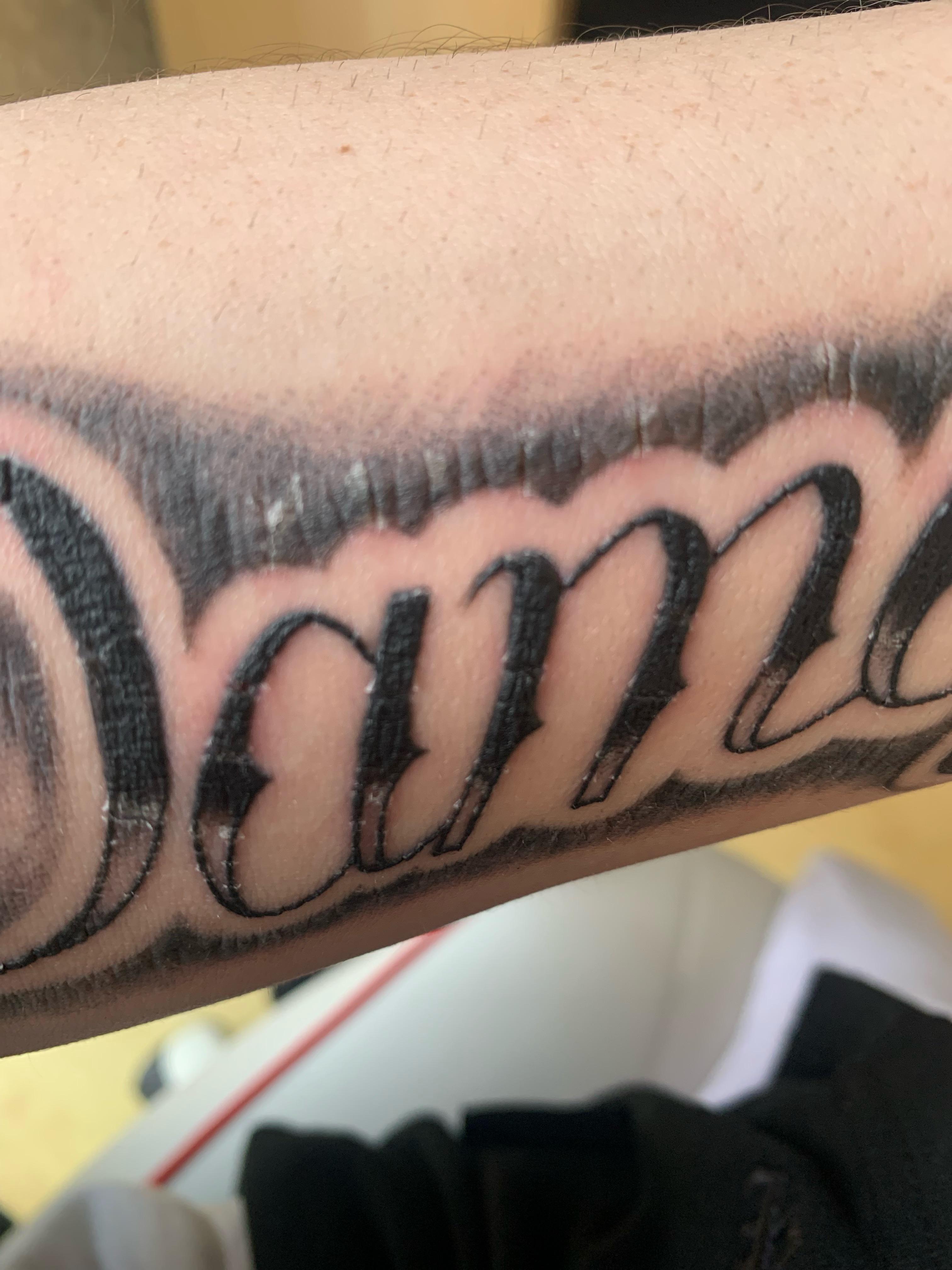 Is it normal for a tattoo scab to crack? This is my first tattoo and I