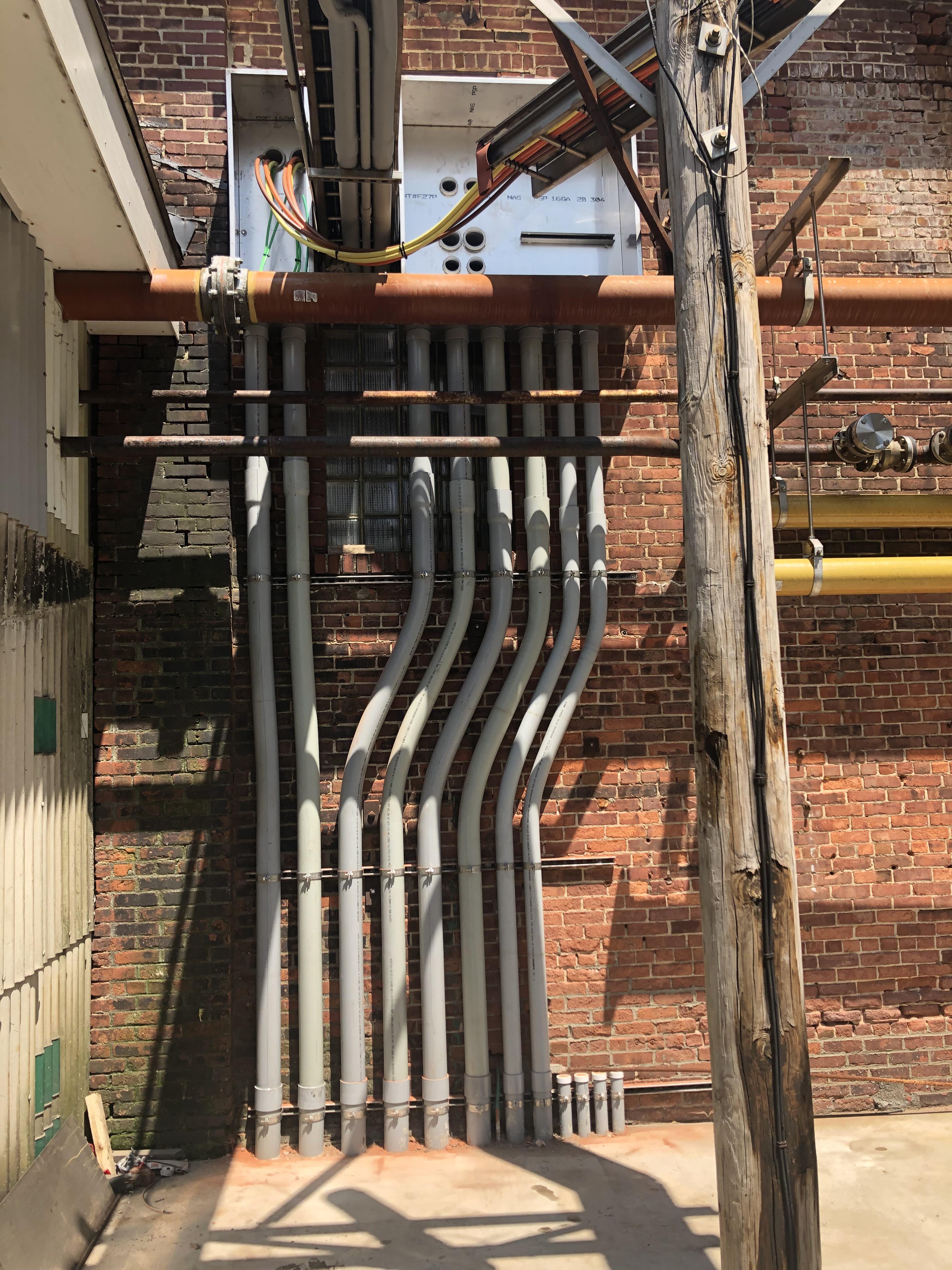 Sch 80 PVC, 64”, 23”. JW & 1st year apprentice. Underground conduit