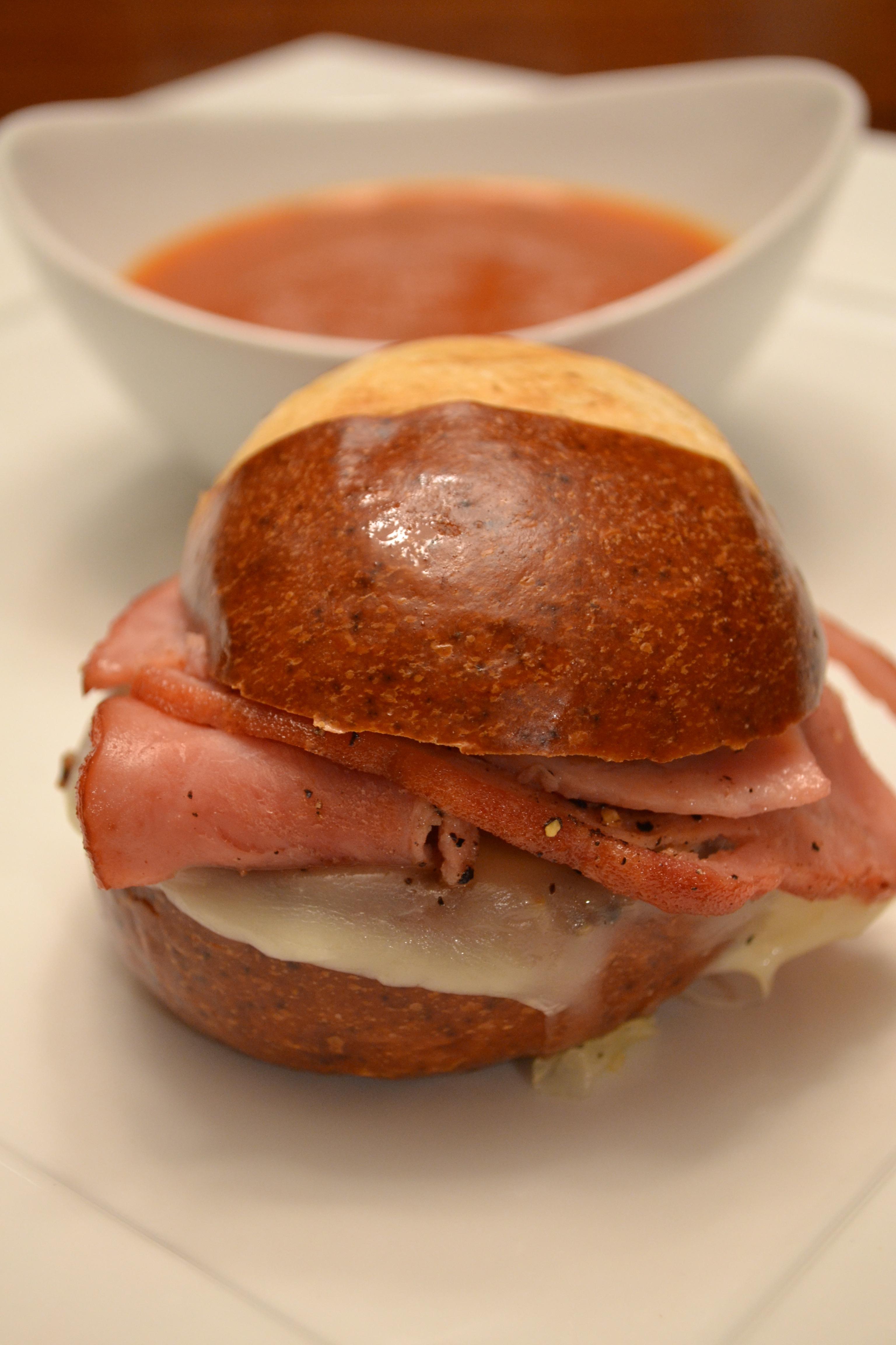 Grilled soft pretzel honey ham and smoked provolone cheese slider. With