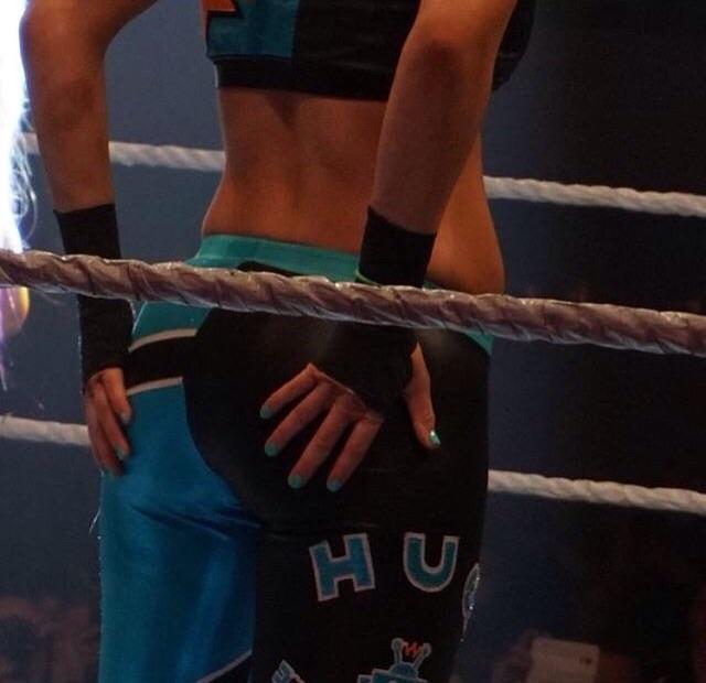 Grabbing her butt Bayley