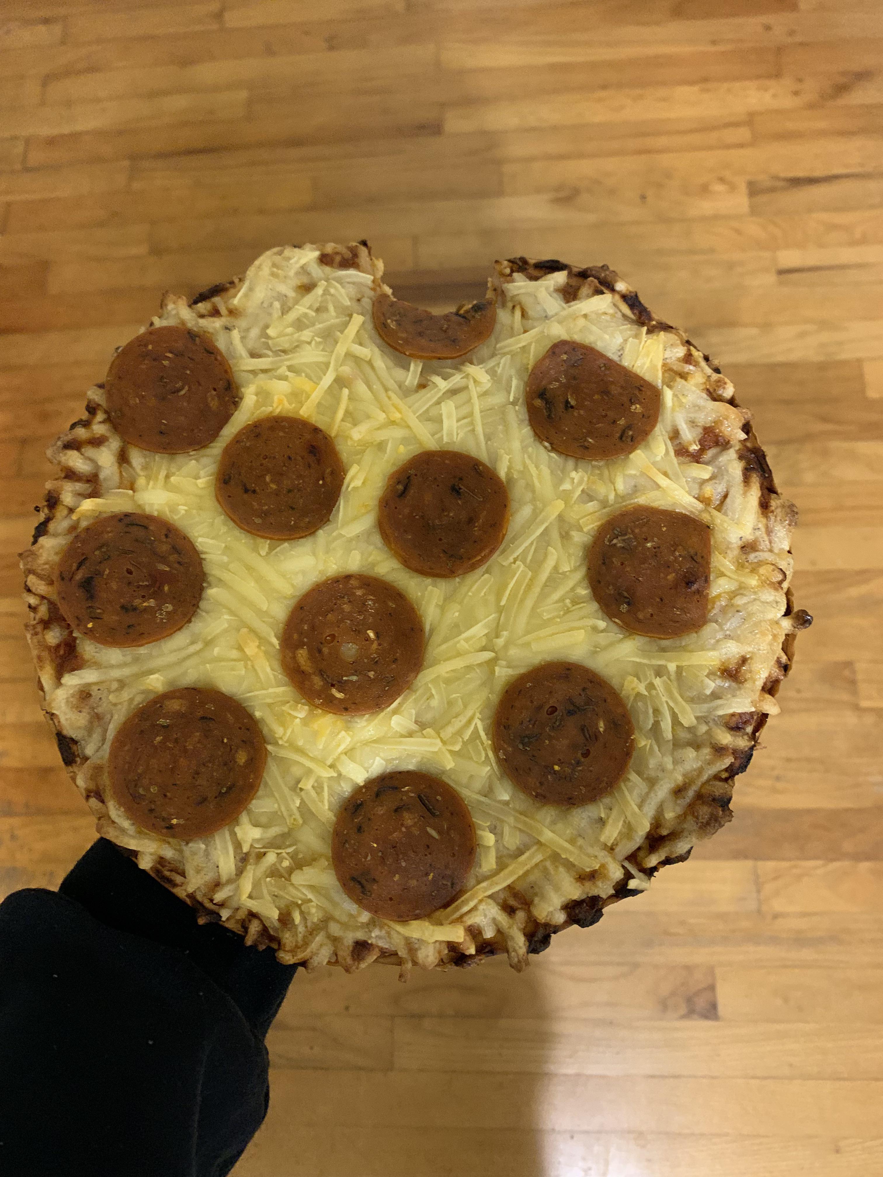 Vegan Pizza . Vegan cheese was gooey like glue . Crust was like